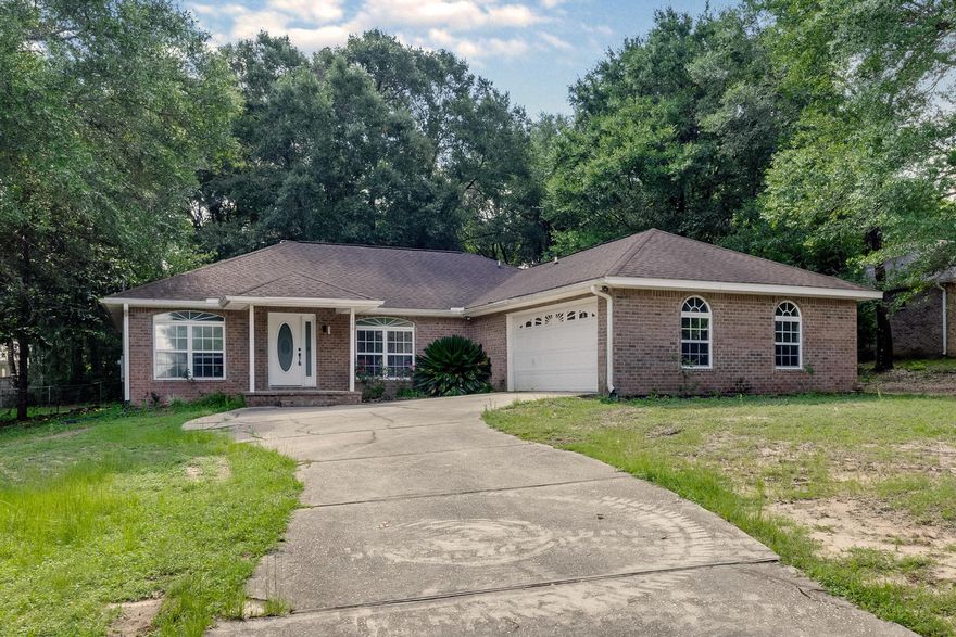 This 3 / 2 home is move in ready ,The home offers split bedroom floor plan with vaulted ceilings, a fireplace in the living room, formal dining room and spacious kitchen with plenty of cabinet space. The master suite features double vanity, garden tub & separate shower. The flooring is tile and laminate (no carpet). The wall color is neutral throughout and will go with any style decor. Enjoy the shady back yard in the screened or open back porch. The subdivision has an HOA that includes a pond that residents are allowed to fish in.