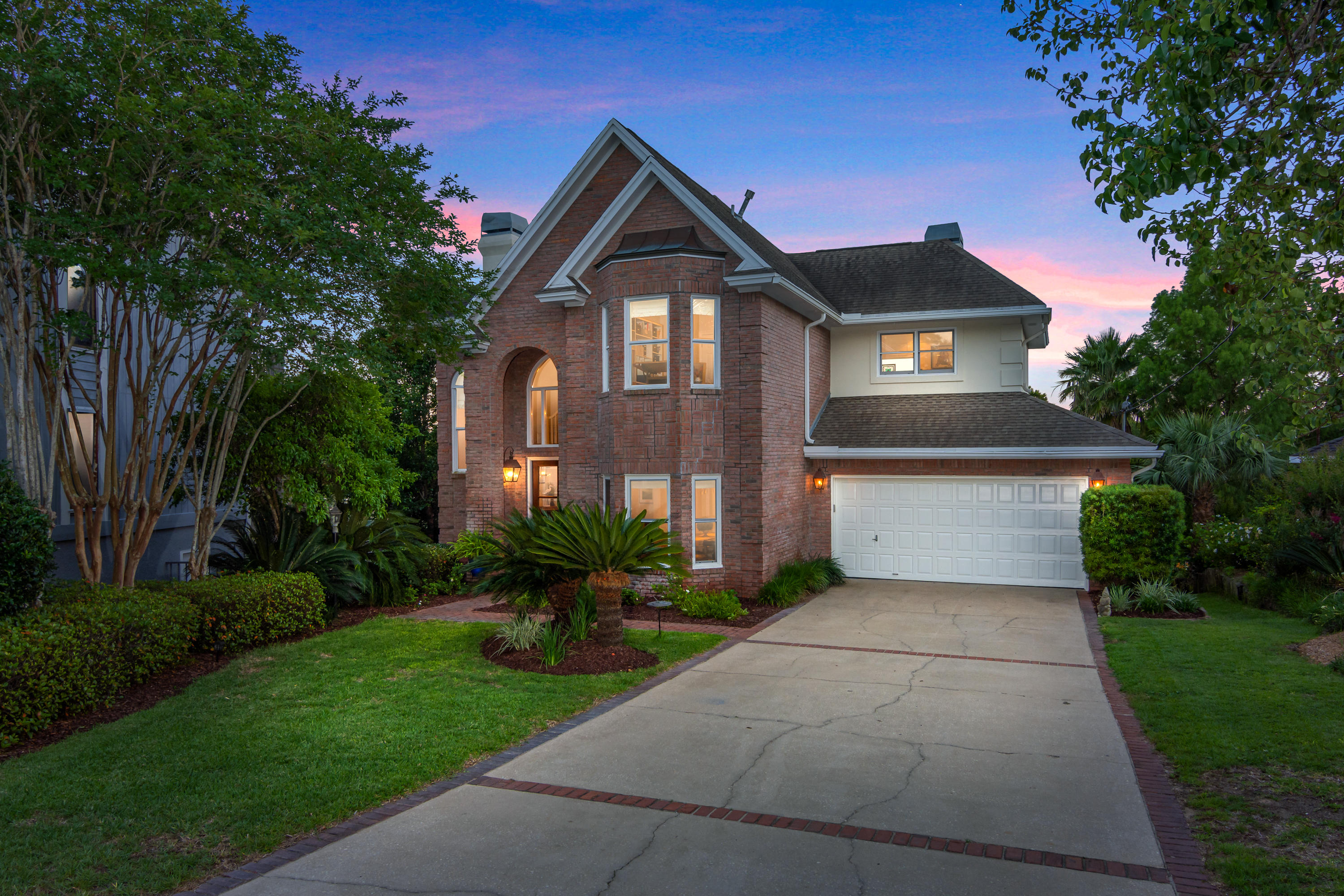 Beautiful & serene waterfront home featuring 4 bedrooms, 2.5 bathrooms and 2771 square feet. Tucked away down a long driveway on a quiet cut-de-sac, this is the perfect coastal retreat. This unique floorpan features a first floor master suite and an additional upstairs 5th room that is a second living room with a lovely fireplace. It is the perfect family floorpan that is open yet cozy & spread out enough to give everyone their own space. The interior features include French pattern travertine and hardwood flooring, limestone countertops in the kitchen and master bathroom, high ceilings, and phenomenal water views from almost every room. In addition, there is beautiful high grade mill work throughout, pre-wired