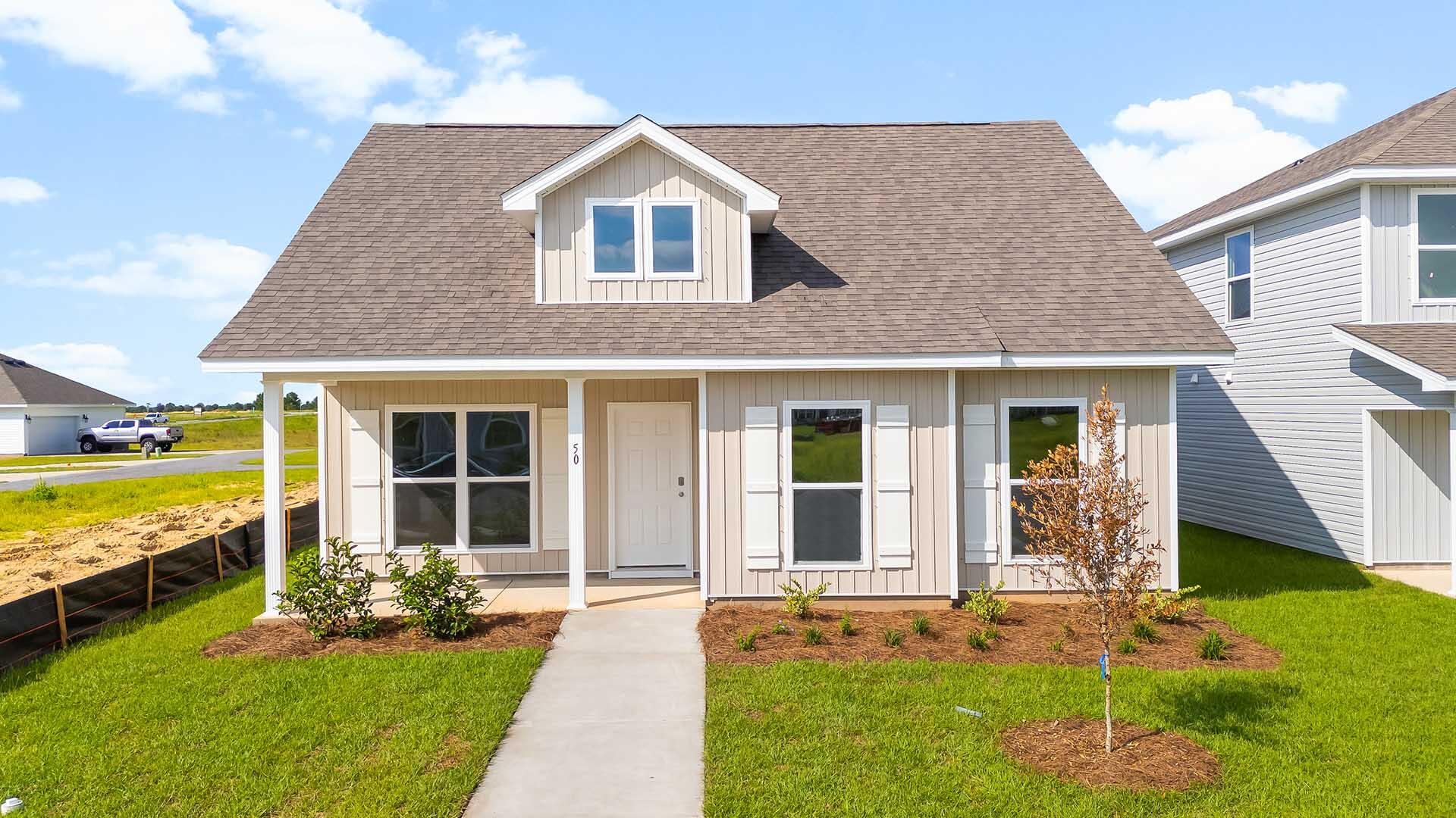 Welcome to 50 Sweetclover Street, a new home at Owl's Head East in Freeport Florida. This home is ready for move in and features the Aspen floor plan, perfect for those seeking a comfortable living space with modern finishes.The large family room serves as the central gathering area, offering plenty of space for relaxation or entertaining. The kitchen, located separately from the living areas, includes a convenient pass-through window that connects to the living room, adding functionality and charm. A separate dining room provides flexibility and can easily be used as an office or a secondary living area. This space opens to a generously sized covered patio, perfect for outdoor dining or unwinding after a long day. Interior features of this home include EVP flooring in the common areas and carpet in each bedroom along with granite countertops and beautiful white cabinetry in the kitchen and bathrooms. The primary bedroom has spacious ensuite bathroom with a shower and two single vanities with cabinetry for storage as well as a closet. The two additional bedrooms share a full bath.
The rear-entry two-car garage enhances the home's curb appeal while providing practical access. Whether you're looking for a modern family home or a layout that adapts to your lifestyle, the Aspen floor plan delivers comfort, flexibility, and style. At Owl's Head you will find plenty of onsite community amenities including a stunning wooded park surrounded by a walking trail.