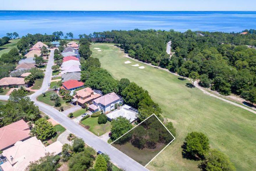Build your Custom Coastal Home on this Gorgeous, beautiful and level Lot on the 15th Fairway in one's of Destin's Premier Golf Communities. This is one of the best priced lots in Destin. Don't miss it.Here you will enjoy peek views of the Bay and a short walk over to Emerald Bay's lovely amenities, including a swimming pool, tennis courts, golf pro shop, and club house where you can enjoy lunch and a full bar! This lot also comes with a fully HOA approved variance granting you more room to build the home of your dreams and have plenty room for a pool and outdoor living space. While this setting is spacious and peaceful, it puts you just minutes from all of Destin's hot spots and gorgeous beaches!  *All Info is deemed to be correct, but buyer/s to verify all details as needed.