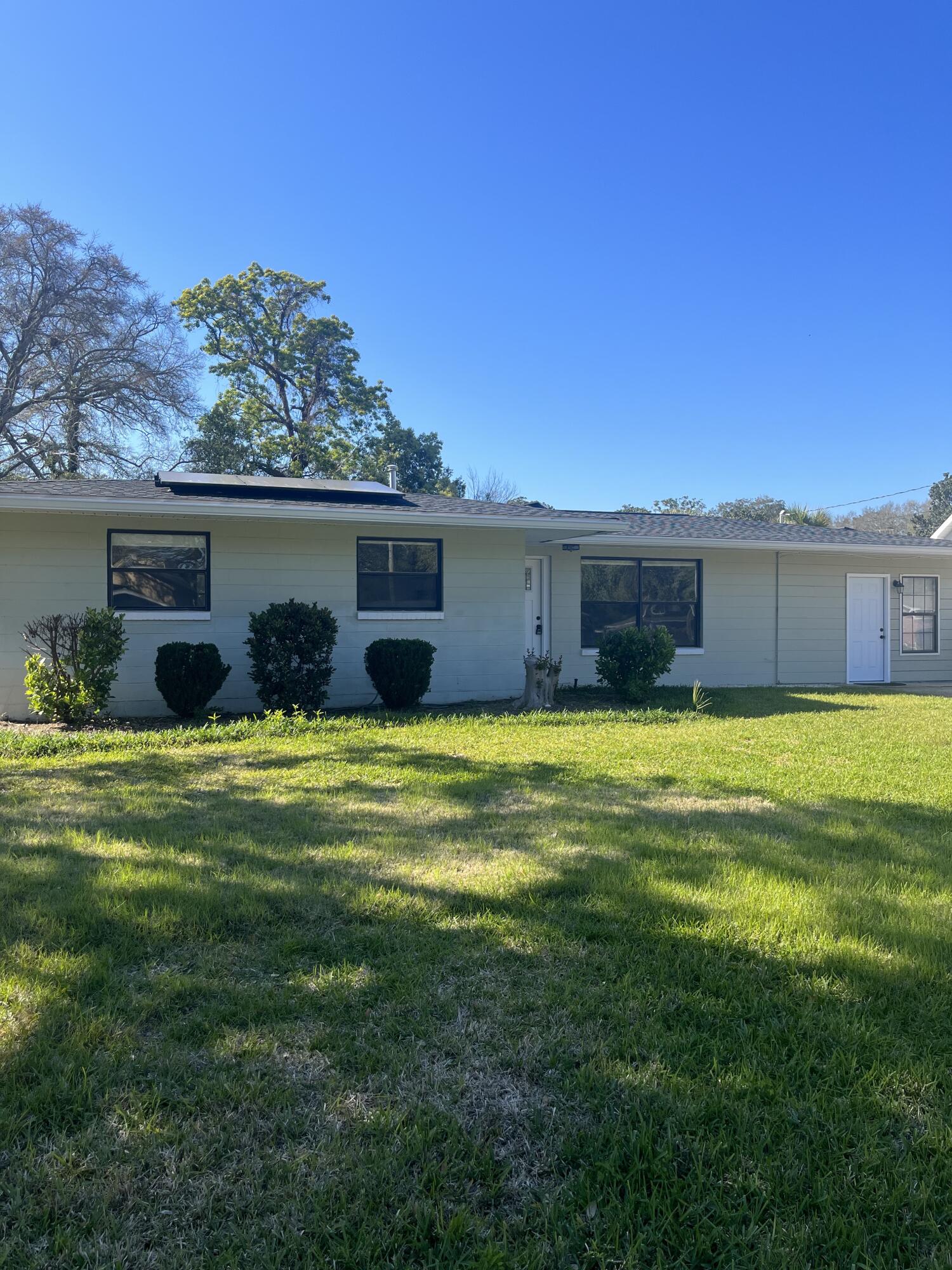 This home has almost been completely remodeled and feels like a much newer property. Recent updates include new kitchen cabinets, butcher block counter tops, stainless steel Frigidaire Gallery appliances, tile floors throughout, new light fixtures, new bathroom vanities, renovated master bathroom, base boards, new doors and door casings, in addition, the hot water heater was replaced in 2015. The yard is large with new landscaping and a storage building in the back. The oversized driveway leads to a back yard perfect for a boat, jet ski or motorcycle. Roof replaced in 2021. Solar panels bring the electric bill down to $40 currently!The house is near Ferry Park and downtown Fort Walton and is in a desirable neighborhood.This property is a must see!