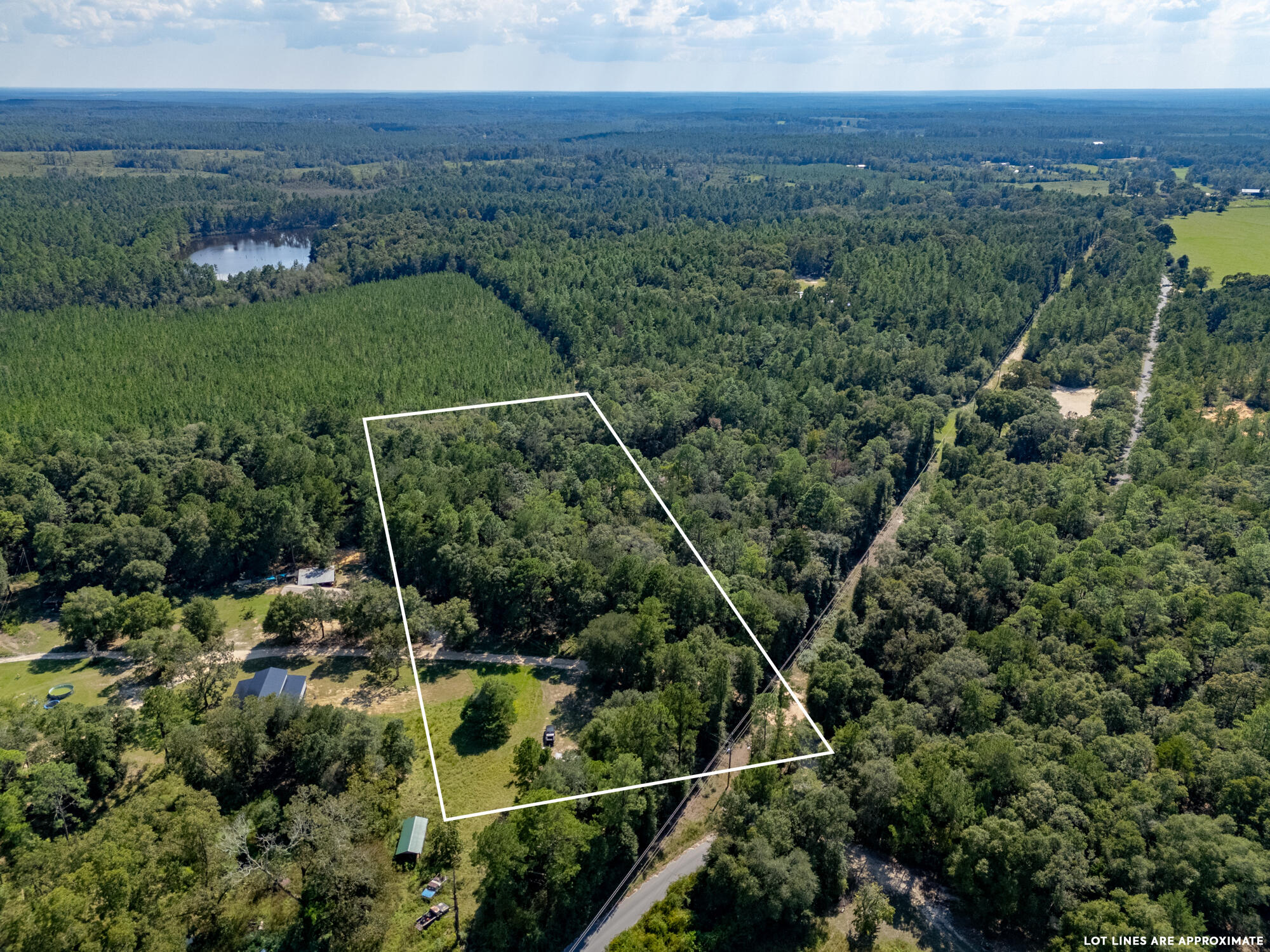 Welcome to your 6-acre homesite! Located in quaint Laurel Hill, Florida. This level, wooded lot is the peaceful oasis you've been looking for! A large pond is located on the property. Imagine spending the day with your kids or grandkids fishing in the pond and exploring the property! Stock the pond, build a home and start making memories! Not ready to build, manufactured homes are allowed as well. City water & electric hook-ups are readily available. Conveniently located only 3 miles from Laurel Hill Schools, 13 miles from Lake Jackson in Florala, 16 miles to Crestview, 35 miles to Destin/Ft Walton Airport & Defuniak Springs, 37 miles to Eglin AFB & 52 miles to the World's Most Beautiful Beaches. Create your own quiet homestead while still being close to everyday amenities!