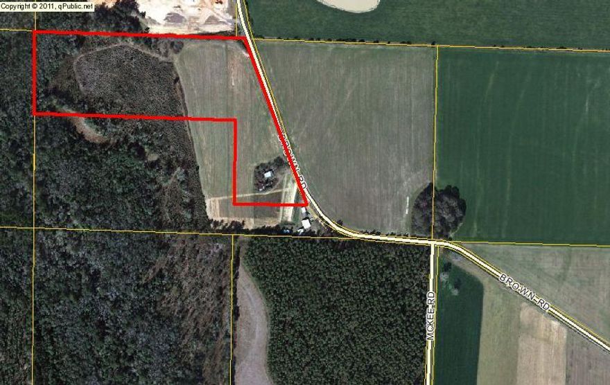 Beautiful location on a paved road underneath big trees in the middle of a field. Farm house is older 2 bedroom 1 bath and needs work. The land is about 25 acres and and where most of the value lies. It would be perfect for horses or farming. Some of the property is currently planted in cotton. Possible owner financing.