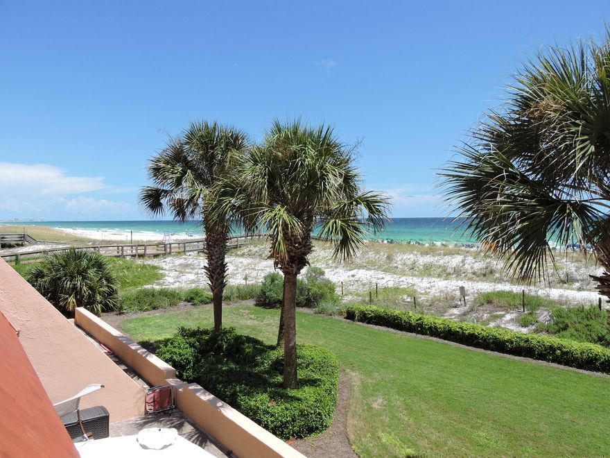 FABULOUS Gulf Front condo with incredible gulf views from this 2 bed, 2 bath, freshly painted condo on Holiday Isle!  The balcony is oversized and spacious.  Perfect place to sip your morning coffee, eat breakfast, and start your day.  If you want to go to the harbor for dinner, just call a water taxi to pick you up.  Just heavenly.  Aegean has lush tropical grounds, super cool pool, shuffle board, 2 tennis courts, gazebo with grilling area, and a boardwalk to 500' of beachfront!  Gated community.  This would be a great investment property or primary home.  Kitchen upgraded with granite counters and SS appliances.  No carpet, washer and dryer in the unit, 2016 HVAC, 2014 water heater.  Owners have reserved parking spaces next to the building.