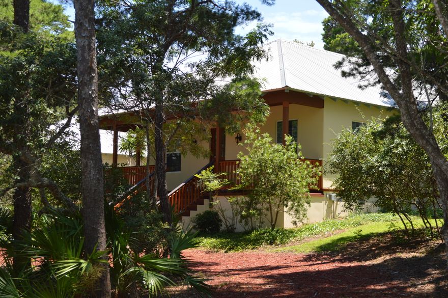 Awesome Craftsman Home for an Incredible Price in Inlet Beach! 3 bedrooms, 3 full baths, open layout and an oversized two car garage located across the street from the public fishing pier on Lake Powell. A wrap around porch, gorgeous landscaping, quality construction and all at one of the highest elevations in Inlet Beach. Recent upgrades include a new refrigerator, washer, dryer, mahogany staircase and rails, and hardwood floors in the master bedroom. The exterior has just been painted and porches stained. You will not find a more maintained, move in ready home for sale! This home sits on over 1/2 acre in Inlet Beach at the dead end of a street surrounded by woods, yet only minutes from Rosemary Beach, the new shops at Inlet Beach and The World's Most Beautiful Beaches! Call Us Today!