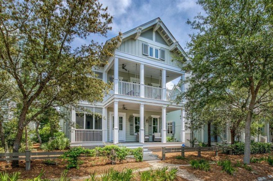 This fully renovated 5 bedroom 5 bath home located in the Lake District of Watercolor has the wow factor that you have been looking for with premium finishes, stunning designer furnishings, shiplap walls and hard wood floors! The home welcomes you with a spacious open floor plan. The gourmet kitchen offers subzero and wolf appliances, gorgeous white quartz countertops, a beautiful tiled wall with open upper shelving, a large center island and lavish light fixtures. The living area offers a fire place which makes for a comfy place to curl up on the couch after a long day on the beach! The first floor also has a large front porch and a screened porch for additional living space. This home also offers the sought after first floor master bedroom.
