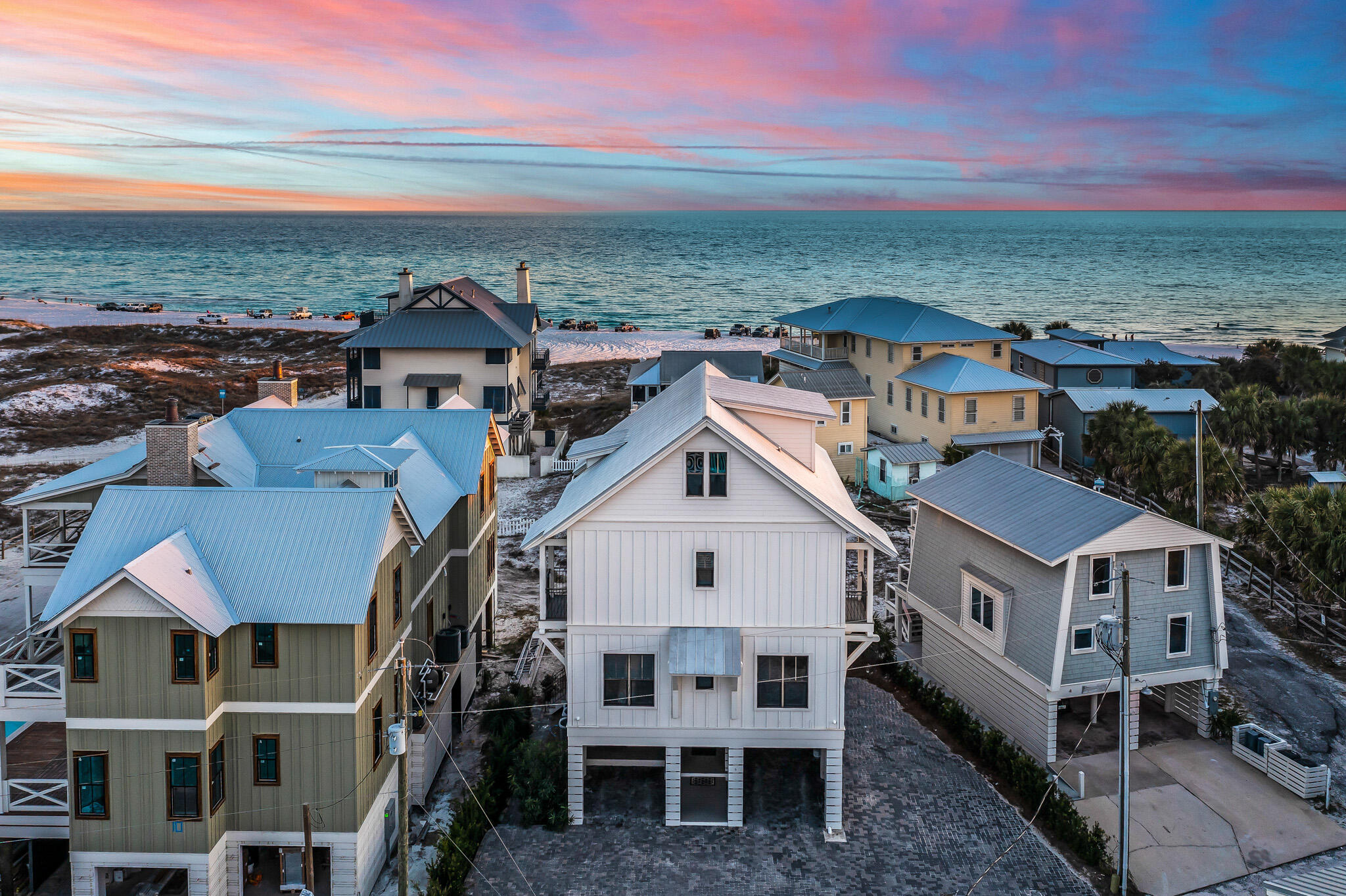 Aptly named ''Dawn Patrol'', grab your surfboard and be the first one to the beach every morning from this perfectly positioned Grayton Beach home. Designed by Geoff Chick and built by Corbin Ousley of CC Ousley Building Company, Dawn Patrol features 7 bedrooms, 5 bathrooms, gulf views & living areas on all three floors, an elevator, a private pool, parking for 8 vehicles, & just steps to the beach. Meticulously maintained and currently operated as a vacation rental ($360k revenue in 2021), Dawn Patrol is perfectly suited for a full-time family or can continue to operate as one of the top rental producers in Grayton Beach.