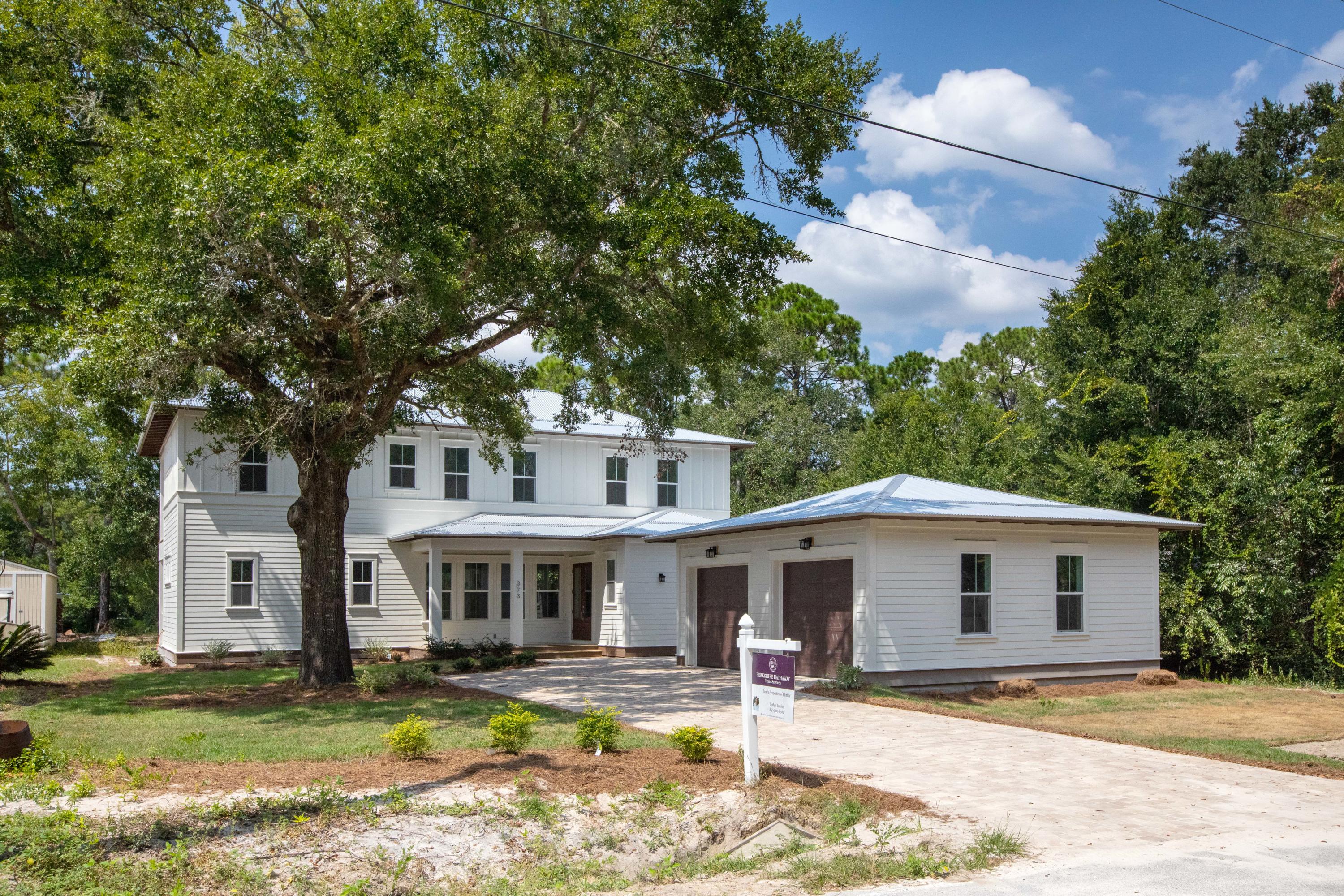 This deep-water CANAL FRONT custom home with 4 bedrooms, 3.5 baths, plus media room/ home office and 2 car garage is located in highly desirable Point Washington. The exterior space features over 800 square feet of covered porches which includes a first and second floor 10x34 covered deck spanning the back of the home overlooking the canal and detached 2 car garage. There is room for a pool too! The interior offers approximately 2,701 square feet and features high end finishes, stainless steel appliances, hardwood flooring throughout, quartz countertops and white coastal cabinetry. The great room, kitchen, dining, master suite, half bath, laundry room and mudroom are situated on the first level. The second level features a second floor master suite, 2 additional bedrooms with Jack-n-Jill