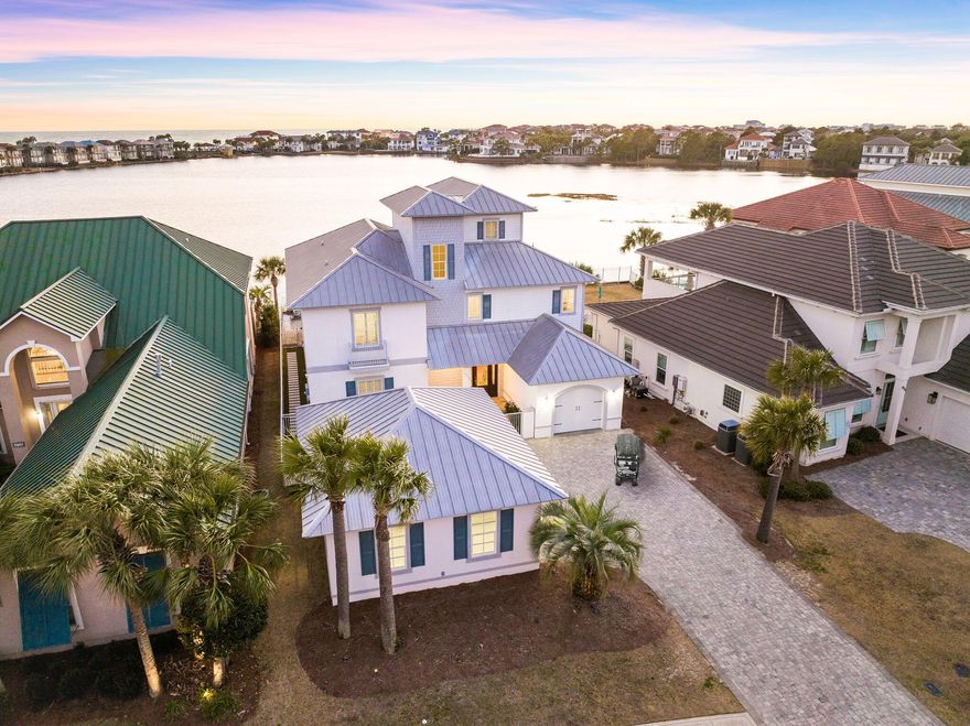 Seller financing available. INVESTORS ALERT! This stunning property generated over $260,000 in gross rental income in 2023, making it a prime investment opportunity. Located on one of the most sought-after lots in Destiny East, this home offers unparalleled panoramic views of both the lake and the Gulf, arguably the best in Destin! Whether you're in the market for a primary residence, vacation getaway, or a high-performing rental property, 'Sundancer' has it all.Step inside to find charm and elegance at every turn, with custom finishes throughout. The open-concept kitchen flows seamlessly into expansive living areas, perfect for entertaining. With six spacious bedrooms, including a dedicated bunk room, there's plenty of space for family and guests to relax in comfort.