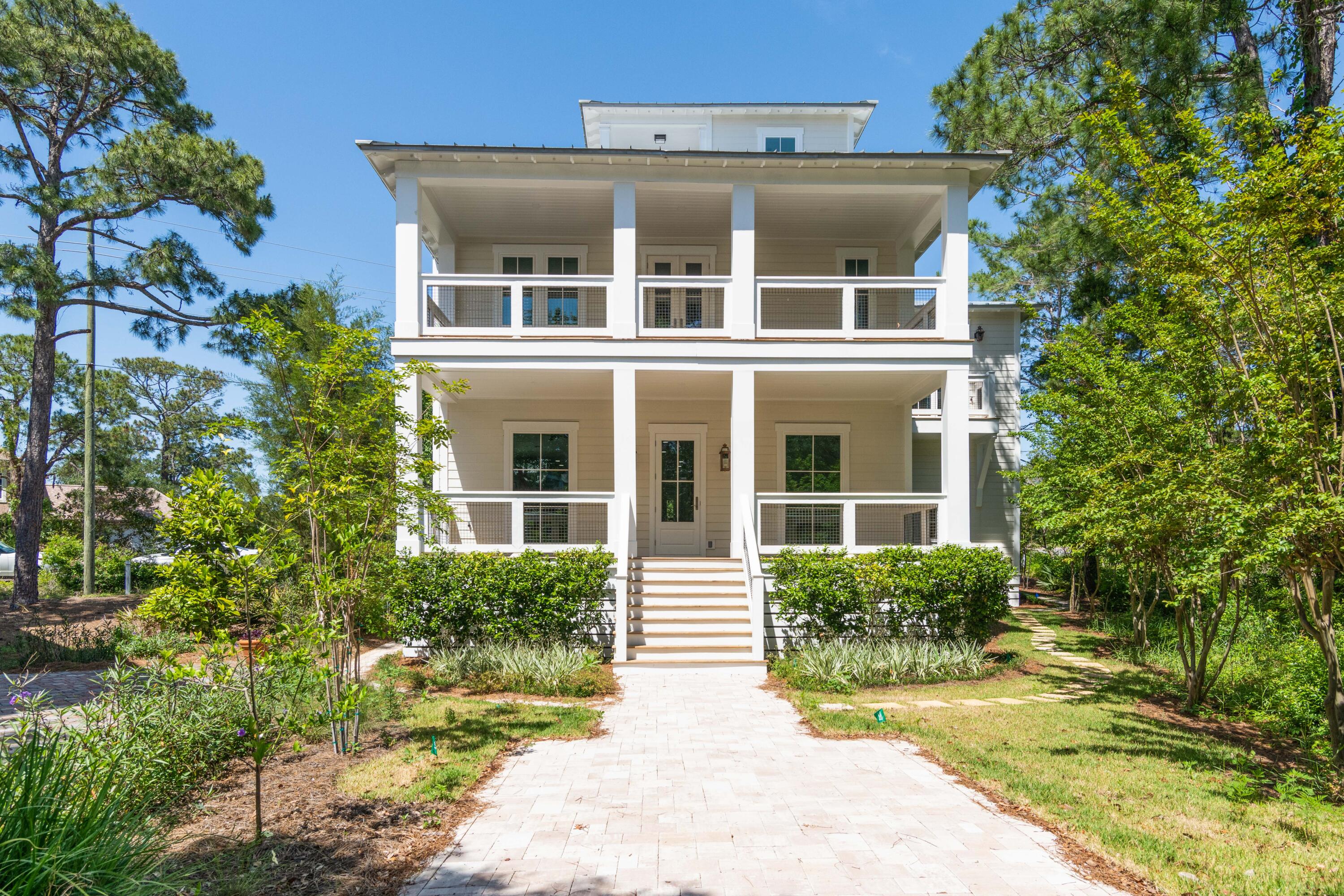 Rare opportunity to own this 5 bedroom, 5 1/2 bath, high end home just steps to the Dune Allen Beach. Situated on a quiet cul de sac in the gated community of Calypso Pointe. This home was fully rebuilt and redesigned in 2021/2022 featuring all new Hurricane impact windows and doors, new walls, ceilings, can lights and hardwood floors throughout. Both HVAC units and tankless water heater are new. New sheet rock on walls and ceilings throughout and new hard wood floors. This home has never been lived in since its transformation. All bathrooms and plumbing are new and designed with high end tile and fixtures. The main floor features an open living concept with gas fireplace, huge kitchen and bar, half bath and with one bedroom ensuite bath and large walk-in closet. Kitchen features all new