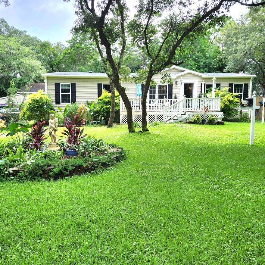 Unique property on .6 acres zoned Mixed Use which allows for a home business.  You'll feel like you're in a park with all the lush landscaping and beautiful serenity garden.  This property has so much to offer with a separate apartment, gym, artist studio, huge workshop, 2 garages, and a 3 room storage building.  Lovingly maintained and  very open with a split bedroom plan.  Fantastic kitchen with gas stove/oven, soft-close cabinets and pull out drawers, good counter space and island breakfast bar.  The master suite features a spacious bath with garden tub, walk-in shower, double vanities and large walk-in closet.  The largest of the additional bedrooms has a big walk-in closet.  No shortage of storage here.  If you're looking for peace and privacy you have to view this property.