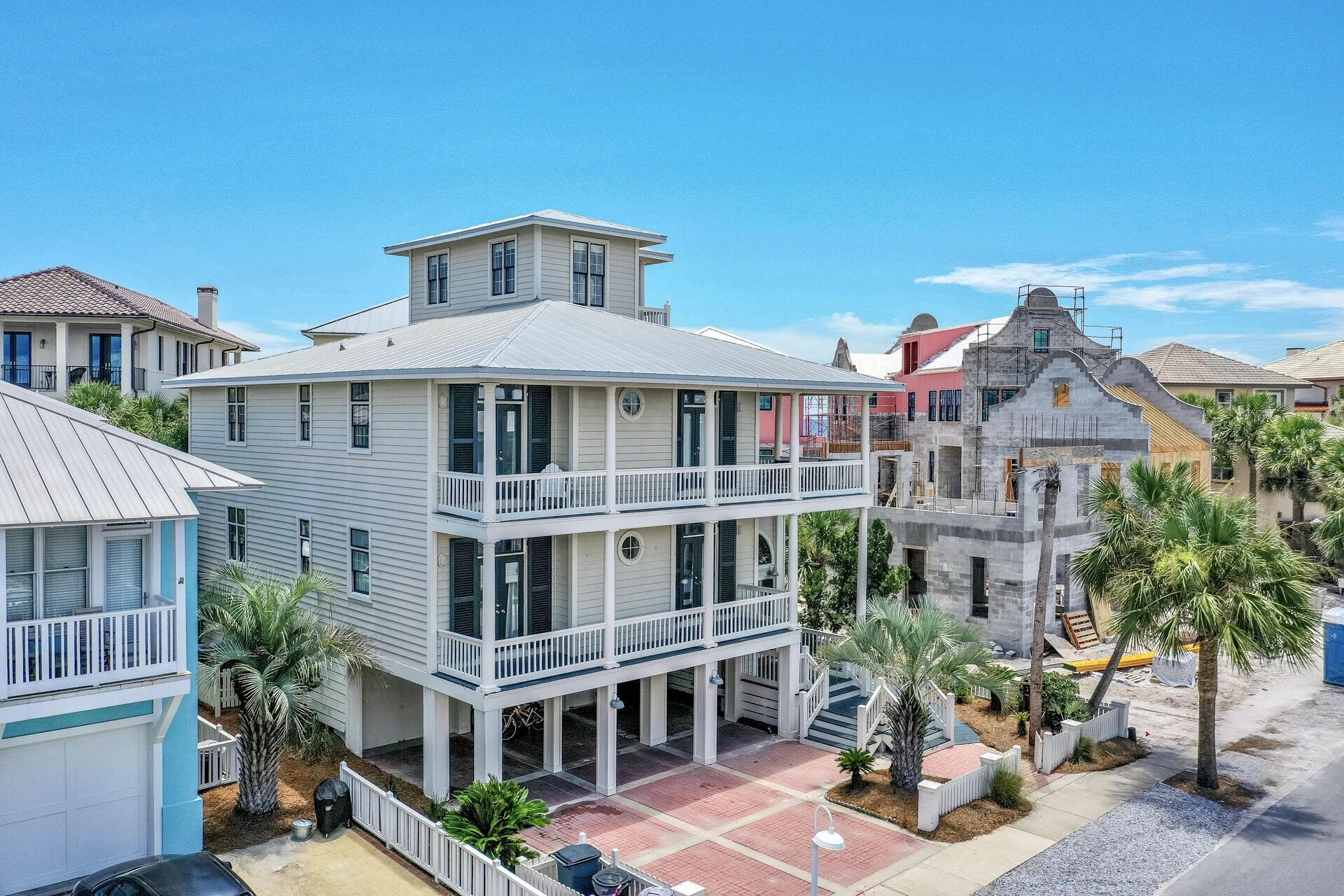 PRICE IMPROVEMENT! -$1,999,500. This well-situated home, with multiple entertaining spaces, is perfect for creating lasting memories.  ''Family Matters,'' just one lot from the beach, with an oversized tower, affords multiple  (2nd & 3rd floor) stunning views of the Gulf and Lake Carillon. Steps to the main community pool, this beach home offers 6 bedrooms, 4 baths, 2 laundry closets, great room, gourmet kitchen, wrap around porches,  separate media/entertainment area w/ large screen tv/surround sound,  wine cooler, ice-maker, refrigerator, microwave/stainless appliances. The lower level features a double garage with two large storage areas plus two additional coved parking spaces. Very strong rental income potential. Contact agent for easy showing ---house now off rental market.