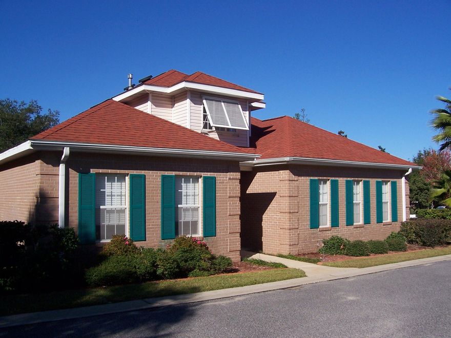 Fantastic Location! Custom Built home located in Gated Community of Magnolia Plantation. This one-owner home located on zero lot line facing the front on Med Circle is a MUST SEE!. Spacious open floor plan. Entry with 18', ceiling Crown Molding,42'' Custom Kitchen cabinets Owner has added a beautiful backsplash in Kitchen, solar attic exhaust fans,Gas fireplace marble facing, 18'' ceramic tile throughout home excluding bedrooms Pella brand back French door and side windows with e-glass and built in blinds. Expanded rear porch/deck with pavers underneath. Hurricane abatement panels/screens for exterior doors and windows, and much more! House is ''piped'' for central vacuum, equipment never installed. Most important lot features a valued Corner lot, long driveway and 10'deep fenced back ya