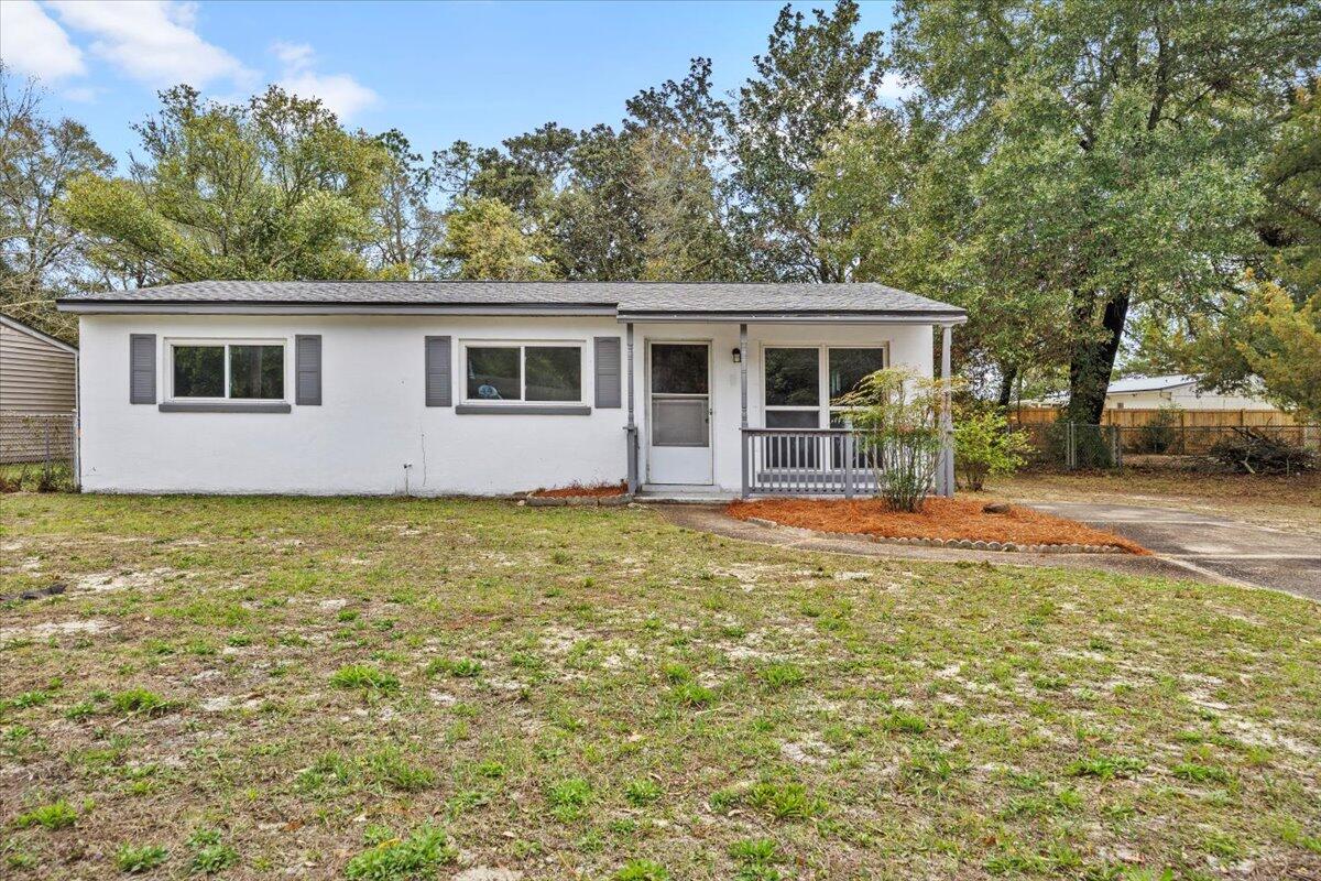 This 3-bedroom gem has had a facelift where it matters! Brand new roof (July 2024), fresh flooring, and a shiny new kitchen with stainless steel appliances. The rest? Well, let's just say there's still room for you to leave your mark (or embrace a little vintage charm). The bonus room is ready to be your office, playroom, or escape-from-the-kids cave. Out back, you've got a huge yard for BBQs, fetch, or future projects you'll 'totally get around to.' All this, just 15 minutes from the beach, no HOA, no flood insurance, and a killer location near shops and restaurants. Perfect for first-time buyers or anyone who loves a little weekend DIY.