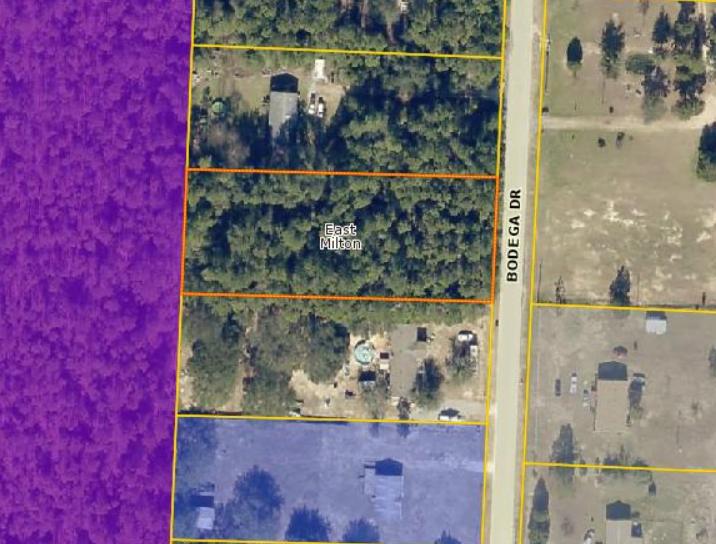 1 acre wooded lot close to I-10 with utilities available on street! Ideal location for a mobile home or to build your dream home! Per property appraiser usage is residential vacant land.