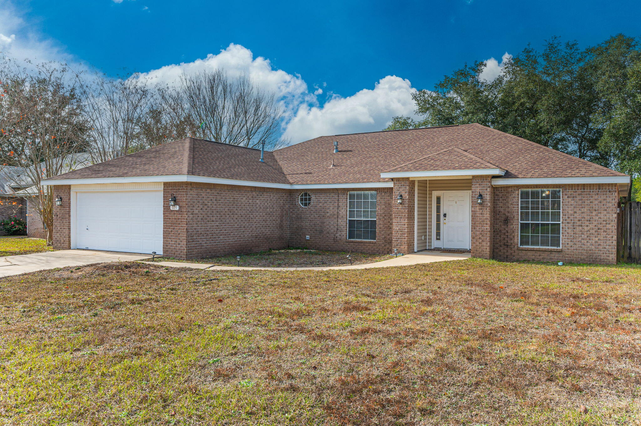 Welcome to this lovely Brick home on a large level lot. This 3 bed, 2 bath home is in a quiet and friendly neighborhood. This home features a split floorplan that offers privacy and comfort. The living room is bright and cozy with cathedral ceiling, and fireplace. Kitchen is well-equipped with stainless steel appliances, island and breakfast nook. The formal dining room is framed with beautifully designed arches. The master suite is separate from the other bedrooms and the on-suite has a walk-in closet. The other two bedrooms are generous in size and share a full bathroom. The backyard is fully fenced with an open patio. This home also has a two-car garage and an interior laundry room. (Roof 2019 / AC 2018 WH 2021) New Flooring !!!