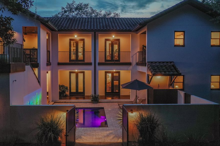Peaceful living behind the exclusive gates of Botany Bayou. Sitting at the end of a quiet oak lined street, this home welcomes you into a park like setting with the kind of peace and privacy you've been dreaming of. Abundant outdoor living spaces, heated courtyard pool, fenced back yard, outdoor fireplace and fruit trees await.Inside, beautiful details and a host of updates greet you. You will love the lofty beamed ceiling of the living and dining room, gorgeous lighting, and doors opening onto the loggia. In the kitchen you'll find a herringbone tile backsplash, new gas range and other notable features like the dual drawer dishwasher, Sub-Zero fridge/freezer, beverage fridge and drawer microwave.
