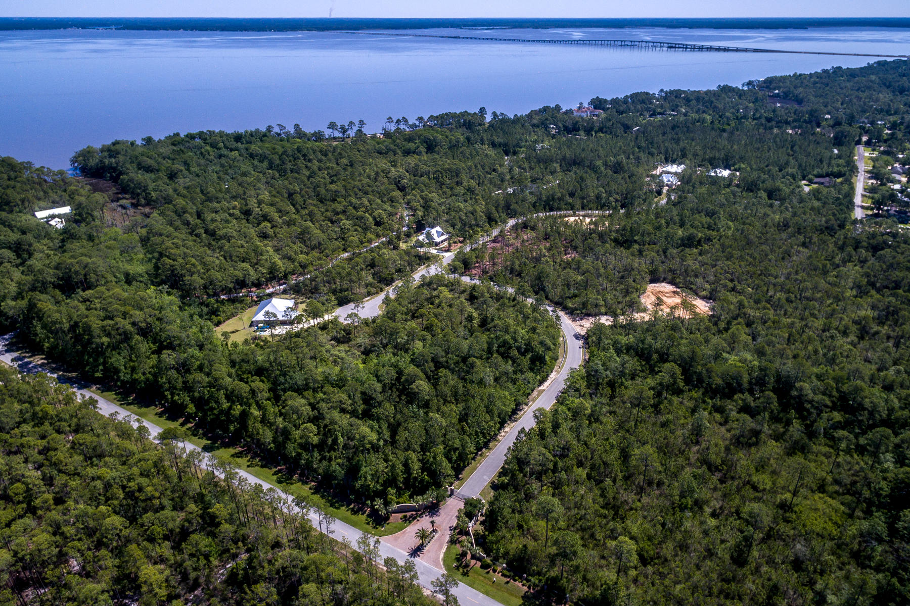 Back On Market! Lot 40 is perfect for your new beach homestead! Steps from the Bay!! LARGEST PARCELS NEXT TO THE BAY!! Rare Find! See Attached Drone Footage! Build you own Dream Home steps away from Choctawhatchee Bay and enjoy community Boat Dock! This gated community of Seclusion Bay offers 53 estate-size lots with 15 acres dedicated to preservation. The lots range in size from .5 acres to 1.5 acres. This community is located within minutes to the beaches of 30A, shopping and dining as well as a short drive to Sandestin Golf and Beach Resort, Grand Boulevard and Sacred Heart Hospital. Buyer to verify all fees and lot dimensions. NEW DOCK is being built.Aerial Video https://www.dropbox.com/s/c6kprx80jw86ite/Seclusion%20Bay%20MLS.mov?dl=0