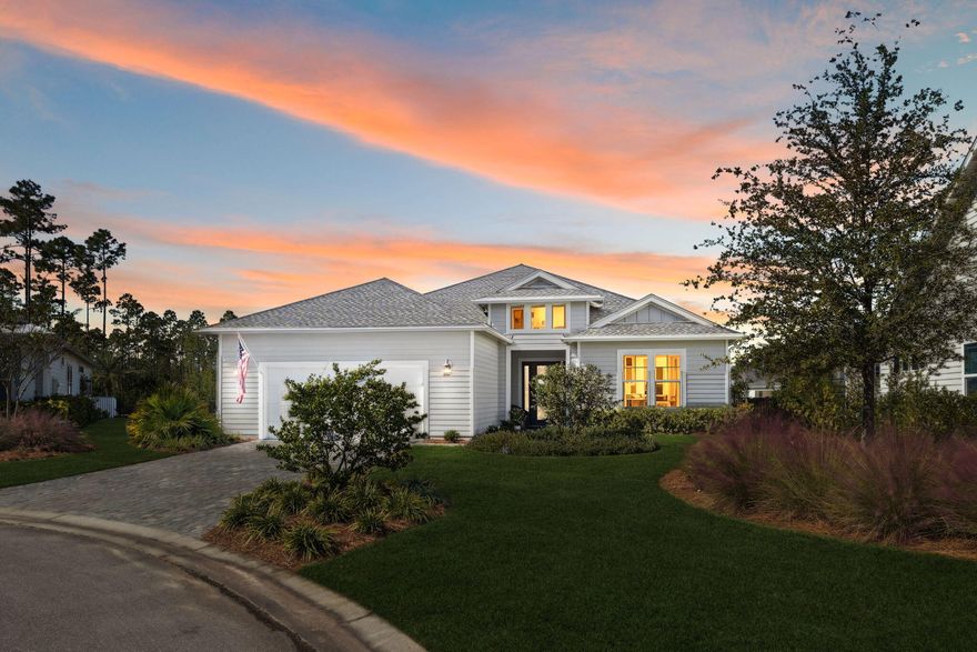 Nestled within NatureWalk at Watersound Origins, the premier gated enclave in the Origins community, this Vilano floor plan home is far more than beautiful architecture; it's a reflection of creativity, craftsmanship, and heart. Perfectly placed on a quiet cul-de-sac surrounded by mature landscaping, this home sits in a peaceful section of the neighborhood where construction is complete and nature has had time to bloom. From the moment you arrive, you can feel that this home was built with love and intention. Every element tells a story. The walnut library wall was handcrafted from a single walnut tree, an heirloom piece that embodies care, patience, and artistry. The dining room and foyer feature acoustic panels with walnut slats, hand-forged lighting with hand-blown glass over the dining table, that create warmth and depth. Each finish, texture, and fixture was personally chosen, adding character and meaning to every room. The kitchen is the heart of the home, designed for both beauty and gathering, with GE Caf?? appliances, an Advantium 5-in-1 oven, quartz countertops, glass upper cabinets extending to the ceiling, a beverage fridge, a custom artful faucet, and a cozy eat-in nook accented by wallpaper. It's a space that inspires connection, conversation, and creativity. The primary suite was thoughtfully positioned at the back of the home to capture the serene pond views and the peaceful reflection of the saltwater pool. Mornings bring soft light across the water, and evenings welcome breathtaking sunsets from the covered porch. With automated screens, a gas line for a future outdoor kitchen or firepit, and paneled doors that open wide to the outdoors, this home invites you to slow down and truly savor the beauty around you. Even the garage was designed with purpose and versatility, epoxy floors, a mini-split for comfort, a screened garage door, and space to serve as both workshop and workout room. Every inch of this home reflects thoughtful design and the pursuit of comfort, creativity, and peace of mind. Behind the scenes, smart technology enhances everyday living with a Lutron automated lighting system, smart irrigation, water leak detectors, security cameras, motion sensors, and extensive data lines throughout the home for reliable connectivity. This home stands as a testament to the person who envisioned it, someone who believed in the beauty of details, the joy of design, and the importance of creating spaces that bring people together. It's a place where craftsmanship meets soul and where every finish and flourish tells a story.