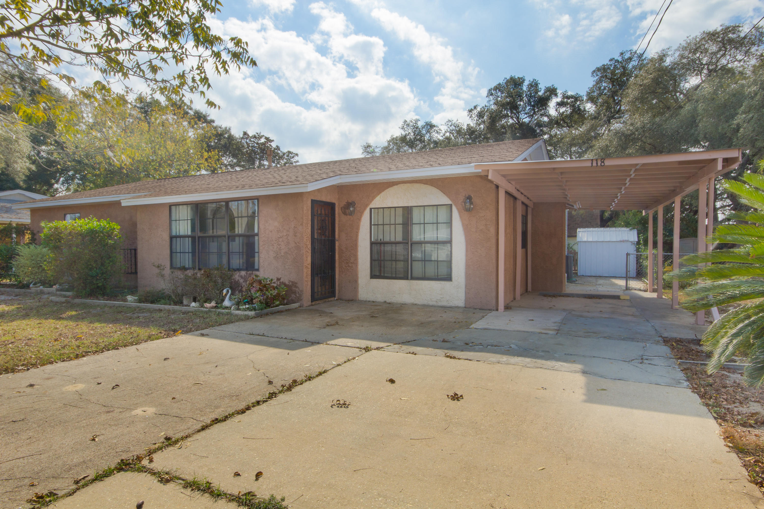 Do you need space? You've found it! This 2325 square foot home includes 4 bedrooms, multiple living areas, dining room, and a separate work area! This home is very conveniently located close to both bases, shopping, and the beautiful beaches our area has to offer. Situated on a large lot, there is also a large yard building with plenty of extra storage. Great home in the heart of Fort Walton Beach. Schedule your showing today!