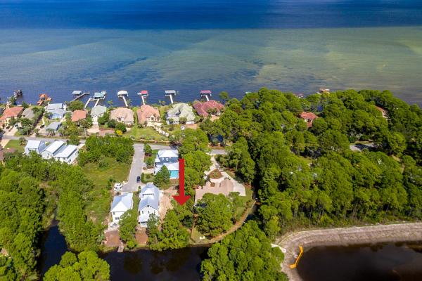 Lake front and bay views. No HOA dues. This rare vacant lot is ready for construction! Conceptual first floor plans available including a first floor master. Survey available.