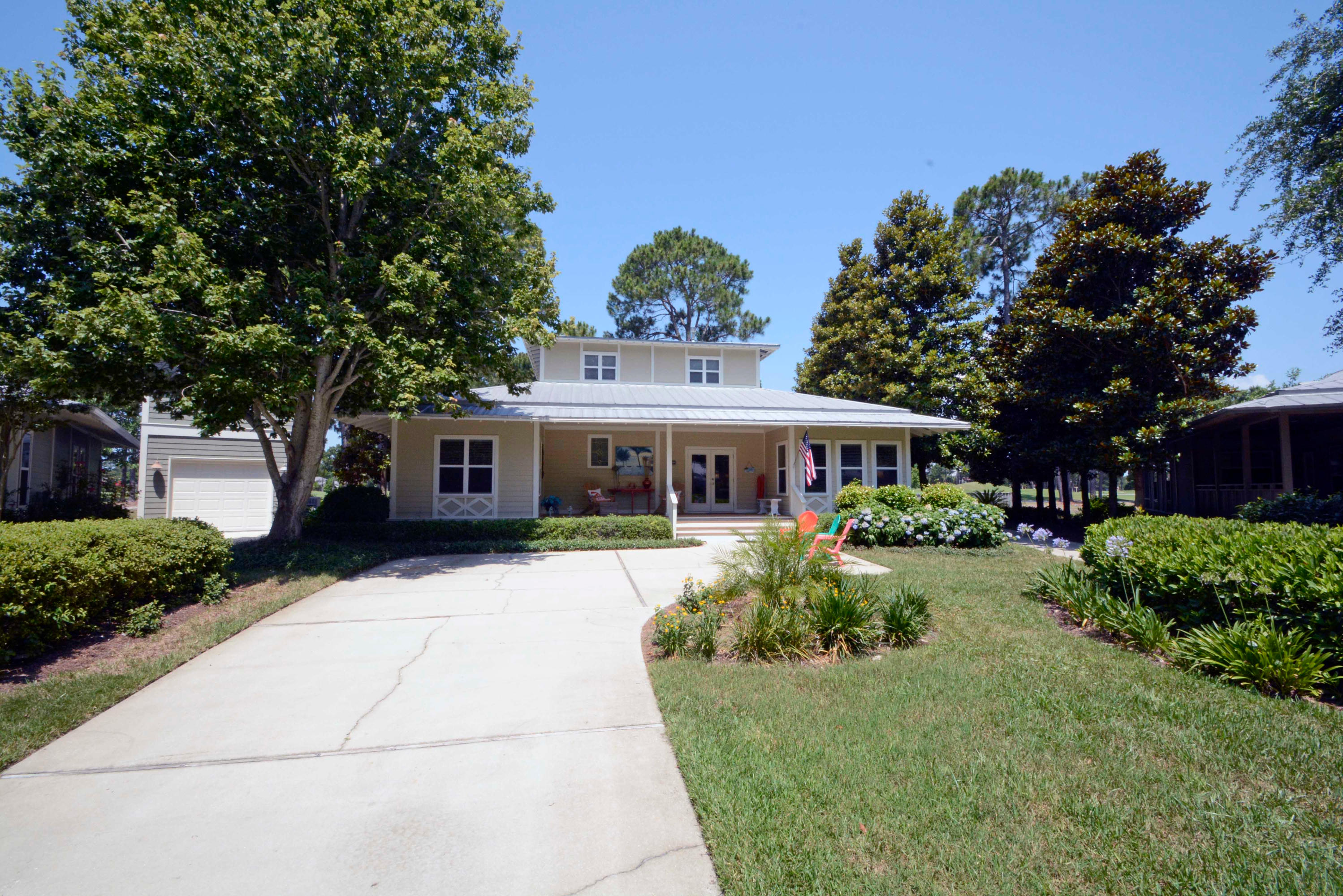 If you are looking for the cutest Florida cottage on the coast you just found it. It is located on the 18th fairway of the beautiful Baytowne Golf course with a pristine lake just steps from the patio. This home would be a perfect vacation spot or permanent residence. The den is very spacious due to the screened porch being enclosed and made a part of the living area. The flooring is beautiful hardwoods with the exception of the bedrooms being newly carpeted. The kitchen has all stainless appliances and beautiful granite countertops. The master bedroom is large with a bunk room/sitting room adjacent to it. The master bath has a shower and garden tub and double vanities. The home is beautifully furnished with very high end furnishings and art work. All furnishings convey with the home