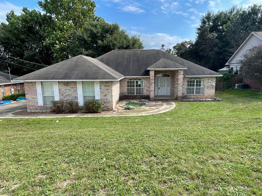 Located just a few mins from interstate access, shopping, and a short drive to Duke Field, this REO home just might be right up your alley. Built in 2002, this all brick 3 bedroom 2 bath split bedroom design home has vaulted ceilings, fireplace in living room, separate dining and breakfast nook and a surprisingly large open kitchen. Masterbath is oversized with separate shower as well as a large garden tub, but what really makes this home pop is the massive bonus room off of the rear of the property. With approx 674sf of vaulted space this room has tons of potential for a super amazing game room, he/she cave, craft room and more. Home does need some work, and therefore, may not qualify for all types of financing, but this home is a definite must see. Call today!
