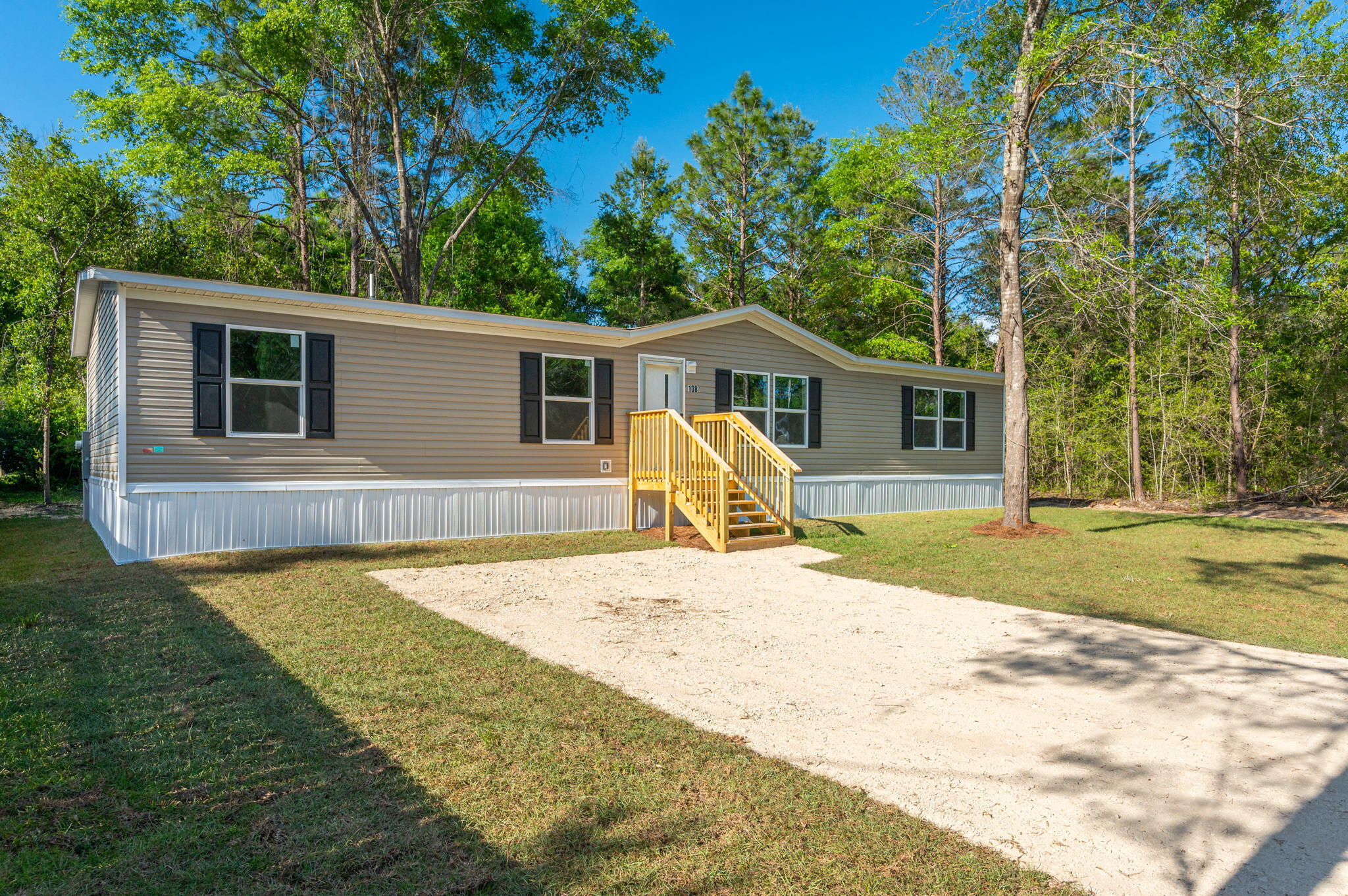 SELLER PAYS CLOSING COSTS UP TO $5,000!! Move-in Ready!!! Beautiful BRAND NEW manufactured home w/ neutral tones and luxury vinyl plank flooring throughout. The home features a spacious living room, family room and a functional kitchen complete with appliances including a refrigerator. The home is situated on a level lot between Defuniak Springs and Crestview. The property features a crushed concrete driveway and privacy fencing on one side of the lot. Convenient to 285 and military bases!