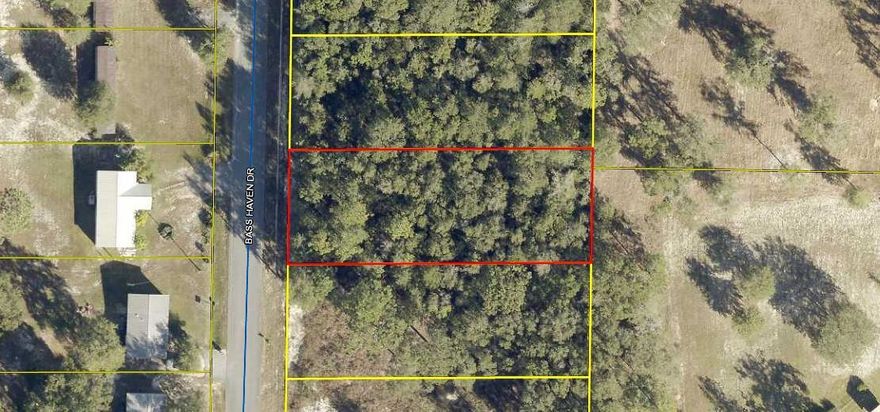 GREAT BUILDABLE LOT! Wooded lot with an 8' privacy fence across the back of the lot. Build your new home or bring your mobile home. Tap fee has been paid and land has been surveyed. Call for a showing today!