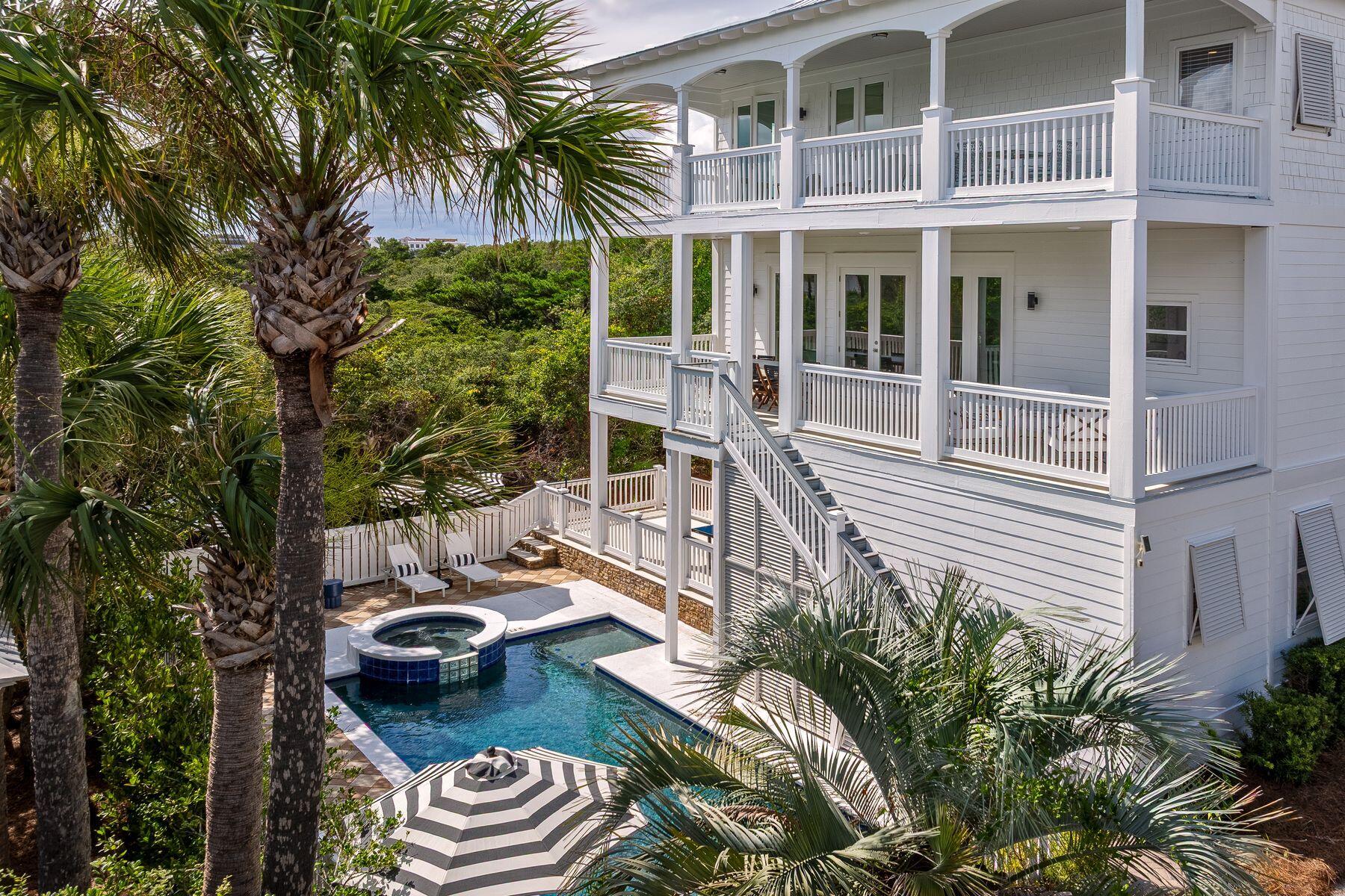 The ONLY 9 bedroom 9 bath home SOUTH of 30A in a GATED community with a PRIVATE BEACH at this price. This outstanding gulf-view reunion-sized house only four tiers from the gulf delivers luxury coastal living with an enviable 30A lifestyle. Located in the upscale, gated community of Sandy Shores, it is one of just 13 luxury homes within this exclusive enclave perfectly tucked away between Rosemary Beach and Alys Beach. The best part, a private beach with beach service. Spread over three floors, this newly remodeled home boasts nine bedrooms, nine full baths, two living rooms, two kitchens and multiple porches overlooking a private L-shaped pool and spa. It's a vacation paradise for investors looking for a rental machine, or a luxury retreat for owners looking to spread out and entertain. Deep porches on every level encourage indoor-outdoor living and provide shady nooks for relaxing with a good book or dining alfresco, cooled by gentle sea breezes. Families will love the 40-foot private pool for cooling off and having fun together, along with ping-pong on the patio. Move indoors to play air hockey or watch TV. A brand new full kitchen on this level is the perfect spot for teens and guests to grab snacks and beverages. With 4 x 2 tile flooring throughout the first level, it is perfect for wet feet or sandy toes. You will appreciate two generous bedroom suites on the first floor each with a full bathroom, and one bath accessible from the pool and patio, and laundry. Thoughtfully built with an elevator shaft to all three levels, an elevator could be added for full-time living. Modern coastal decor continues upstairs for a laid-back ambience in the second-floor great room. Lie back in cushioned comfort in the sitting room and appreciate this amazing hideaway. A refectory dining table invites intimate social conversation over tasty local seafood prepared in the coveted chef's kitchen. Fully equipped with high-end appliances, it has everything you need, from the wine refrigerator to the island bar. Three more bedrooms on this level each have a full bathroom. Doors open directly onto a full-width porch with stairs leading down to the pool for a morning dip. The lavish master suite is on the top floor and includes a vast bathroom showcasing a soaking tub with gulf views, large walk-in shower and dual vanities. Throw open the French doors and embrace each new day from the privacy of your own 38-foot balcony. Three additional bedrooms, three beautiful ensuite bathrooms and a second laundry. Last but not least, the metal roof was just replaced in 2025. Contiguous to Paradise by the Sea (a no short term rental community), this home puts you at the heart of 30A shopping, upscale and casual dining, and non-stop entertainment. The white-sand beach offers private access for owners and a seasonal beach chair service. You will never find your beach too busy, and you always have a spot to enjoy. Consistently generating more than $350,000 in rental income and projections exceeding $500,000, this outstanding beach house with parking for eight vehicles and a garage spot perfect for storing a golf cart, is an entertainer's nirvana and the perfect venue for weddings, reunions and family gatherings.