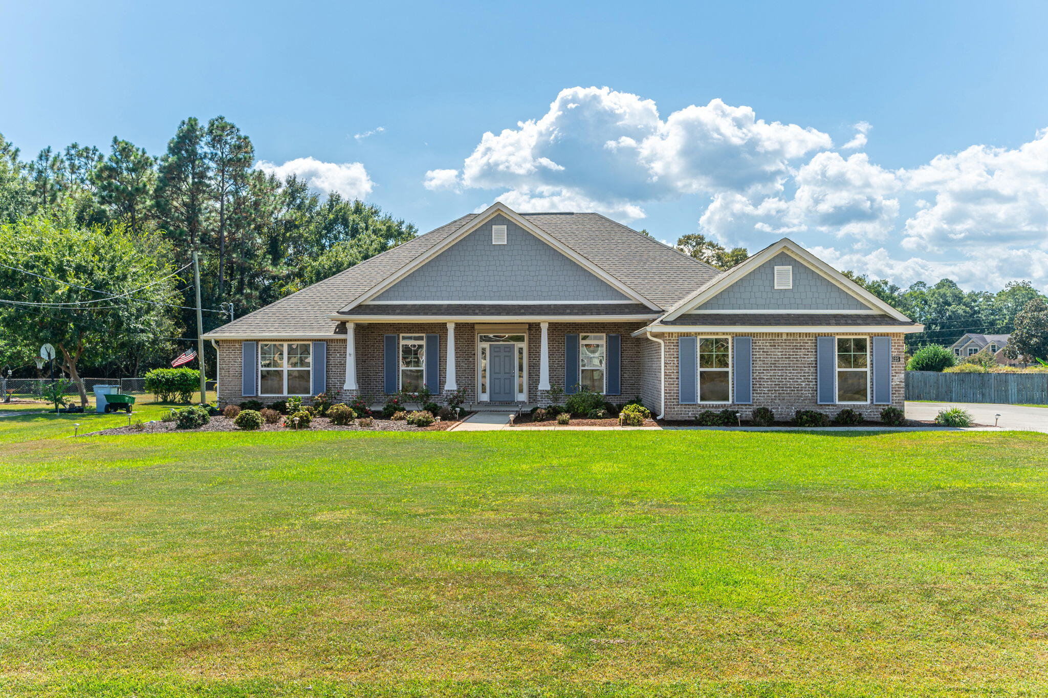 This stunning property that offers the perfect balance of modern comfort and everyday functionality. This 4-bedroom, 3-bath, 3-car garage home sits on a spacious 0.83-acre lot and features more than 2,700 square feet of thoughtfully designed living space. From the open-concept layout to the quality finishes throughout, every detail has been considered.The kitchen serves as the centerpiece of the home with sleek granite countertops, a large island with abundant storage, a gas cooktop, and a stainless steel French door refrigerator with champagne gold hardware. It flows seamlessly into the living room, where the open space easily accommodates a large sectional, creating a warm and inviting environment for entertaining or simply relaxing at the end of the day. Luxury vinyl plank flooring runs through the main living areas for a clean, modern look, while the bedrooms are finished with plush carpet for comfort and the bathrooms feature tile. The primary suite is designed as a retreat, offering generous space, an en-suite bath with modern finishes, and plenty of natural light.
Step outside to enjoy the enclosed patio with seamless screening, the perfect spot for morning coffee or evening gatherings while overlooking the expansive backyard. With nearly an acre of land, there's plenty of room for outdoor activities, gardening, or even adding future features like a pool or workshop.
Additional upgrades make this property stand out, including a propane generator with a 500-gallon propane tank, as well as custom aluminum storm windows and door shutters finished with a durable powder-coated color. These thoughtful additions provide both peace of mind and enhanced curb appeal.
Blending style, function, and space inside and out, this home offers a rare opportunity to enjoy comfortable living on a large lot with modern conveniences already in place.