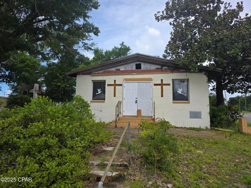 Corner lot on Hwy 98 West zoned C-2 with 140 feet hwy frontage. The parcel has a traffic count of 48,000 vehicles a day. This designation permits a wide array of uses, including retail, professional offices, restaurants, service businesses, and potentially more (buyer to verify specific permitted uses with Panama City Planning and Zoning). The building is in need of renovation and priced for land value only for a quick sale.