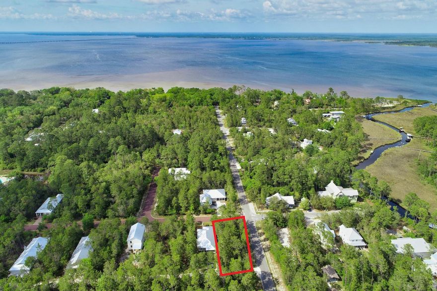 LOCATION LOCATION LOCATION!! This is the perfect CORNER lot ready for your dream home and is only a few minutes from the white sandy beaches of 30A! Grayton Bayou is a sought after community in Point Washington located directly north of Grayton Beach. This lot is a premier location surrounded by beautiful Point Washington State Park. You can enjoy the outdoor coastal lifestyle with nearby biking & hiking trials, camping, and there is a community boat launch all within reach. This neighborhood also offers a great community pool, hot tub and is a welcoming setting with paver streets. There is also a great Walton County bay front park just down the street! There are no build out times for this lot and low HOA fees. Dont miss out on the opportunity to own one of the best lots in Grayton Bayou!
