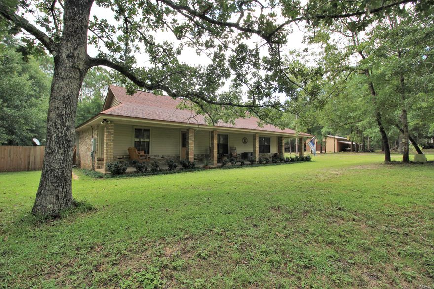 Charming brick home sitting on 1.8 =/- acres of privacy with a fence yard and a 30'x30' storage building with added loft storage. The house has a large living area, dining room and separate sitting room. The master bedroom is large with his and her water closets. Nice hardwood floors, brick fireplace, an amazing covered porch and garage space. New roof in 2012, new a/c in 2014 and all new plumbing in 2018.