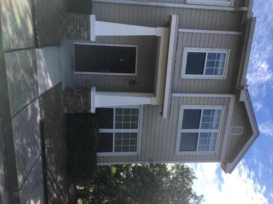 Classic sophistication and design merge in this one owner, end unit with tile in kitchen, foyer and all bathrooms, 9' ceilings on the first floor and stylish berber carpet in living room and bedrooms. Kitchen adorned with black Whirlpool appliances, Fridge with water and ice in the door, Uba Tuba granite counters and breakfast bar. Plenty of storage to include pantry, coat/broom closet and laundry room with wire shelves for extra items. Half bath with pedestal sink just around the corner from the office with double french doors. All bedrooms located upstairs with ceiling fans and two bathrooms with tub/shower combinations-the master vanity has granite counter-tops. Spacious covered patio for your relaxation overlooking the green space, natural landscape and