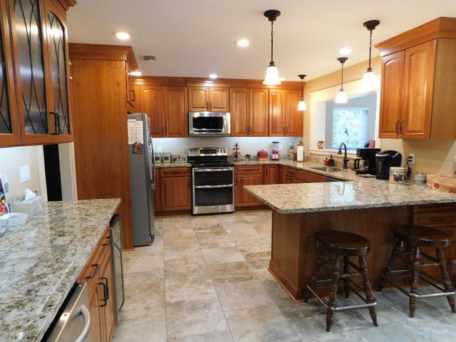 Stunningly Renovated, one owner home on one acre with an in ground pool and 2 large garages! This home is nicely located in the NW section of Crestview, sits on over an acre of lush landscaping and enjoys lower county property taxes. The owner just recently did a major renovation in the amount of $200,000! All new kitchen with soft close Maple wood cabinets, tiled floors, stainless steel appliances, new hardware, fixtures and interior doors throughout. All ceilings are knock down textured. This home has so much to offer with beautiful bathrooms of tile and cultured marble, antique hardware though out, large tiled floors. Outside you will find a piece of paradise with the acre of mature landscaping. An in ground pool, 2 HVAC systems and 2 working septic systems, a long paved driveway!