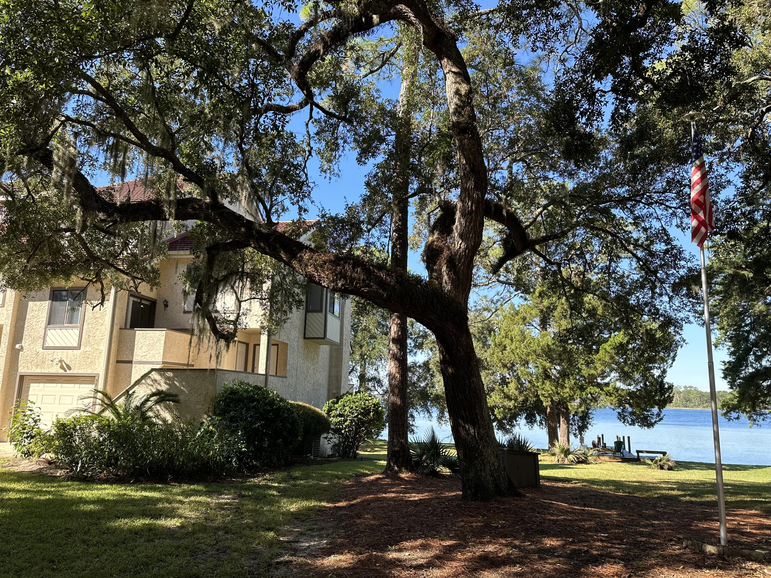 You don't want to miss this incredible opportunity located on the breathtaking water of the Choctawhatchee Bay. This townhome is located in the beautiful and well maintained community of Blue Water Bay. This desirable end unit offers stunning marble and hardwood flooring as well as crown molding throughout. The kitchen is finished with Oak cabinets with glass front doors, granite countertops, stainless steel appliances, and prep Island. The master bathroom has vaulted ceiling and en suite bath with separate shower, jetted garden tub, double vanity and makeup area. Located a short distance from the white sandy beaches and emerald green water of The Gulf of Mexico and all that Destin has to offer.