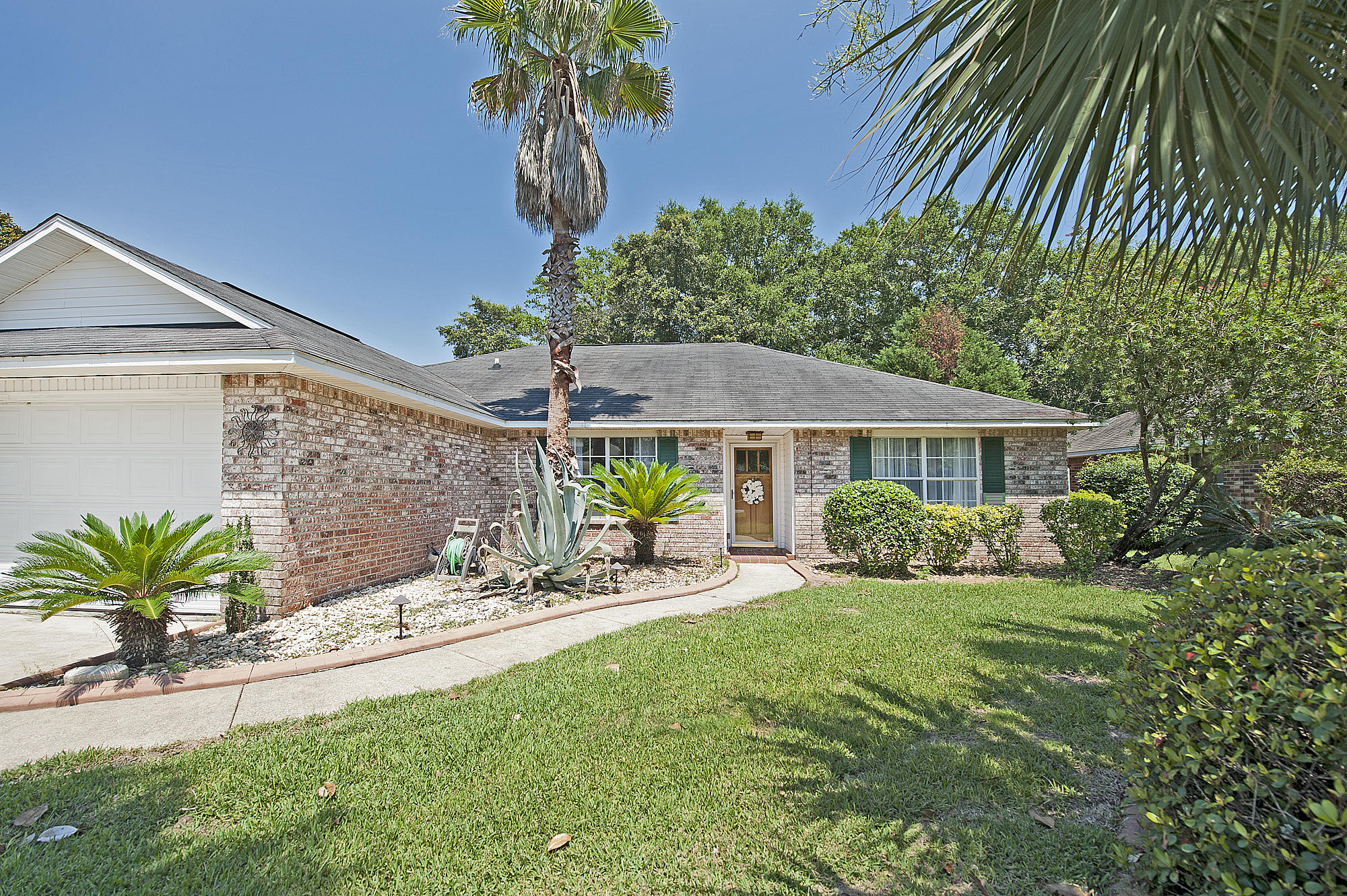 Situated on the beautiful sound side of 98, is Navarre's newest 4 bedroom 2 bathroom beautiful home. Boasting over $20,000 in upgrades, the home leaves you awe struck. As you walk up to the home, you'll notice fine landscaping with attention to detail, amidst a very tropical vibe filled with palm trees and a modern rustic wooden front door. Enter the home into an open concept great room, ideal for entertaining before a wood burning fireplace. The dining area sits beneath a beautiful light fixture, with views directly into the private backyard. The kitchen is the heart and sole of the home, featuring stunning white and grey stone granite countertops, large center island with pot storage overhead, all stainless appliances, grey cabinetry, new sink, faucets, stove and microwave. Each bathroom in the home is outfitted with the same beautiful granite, and new sinks with hardware as the kitchen. The master bathroom also features an energy efficient toilet, as well as dual vanity sinks, and a close away toilet room. Outside you'll enjoy a fully privacy fenced getaway, with a florida room. As part of the complete package, this home has a brand new HVAC unit as of 2017. Owning this beautiful property will also allow you to walk the beach whenever you please, as there is deeded beach access with a gazebo and picnic area as part of the neighborhood. Make an appointment to see this home today!