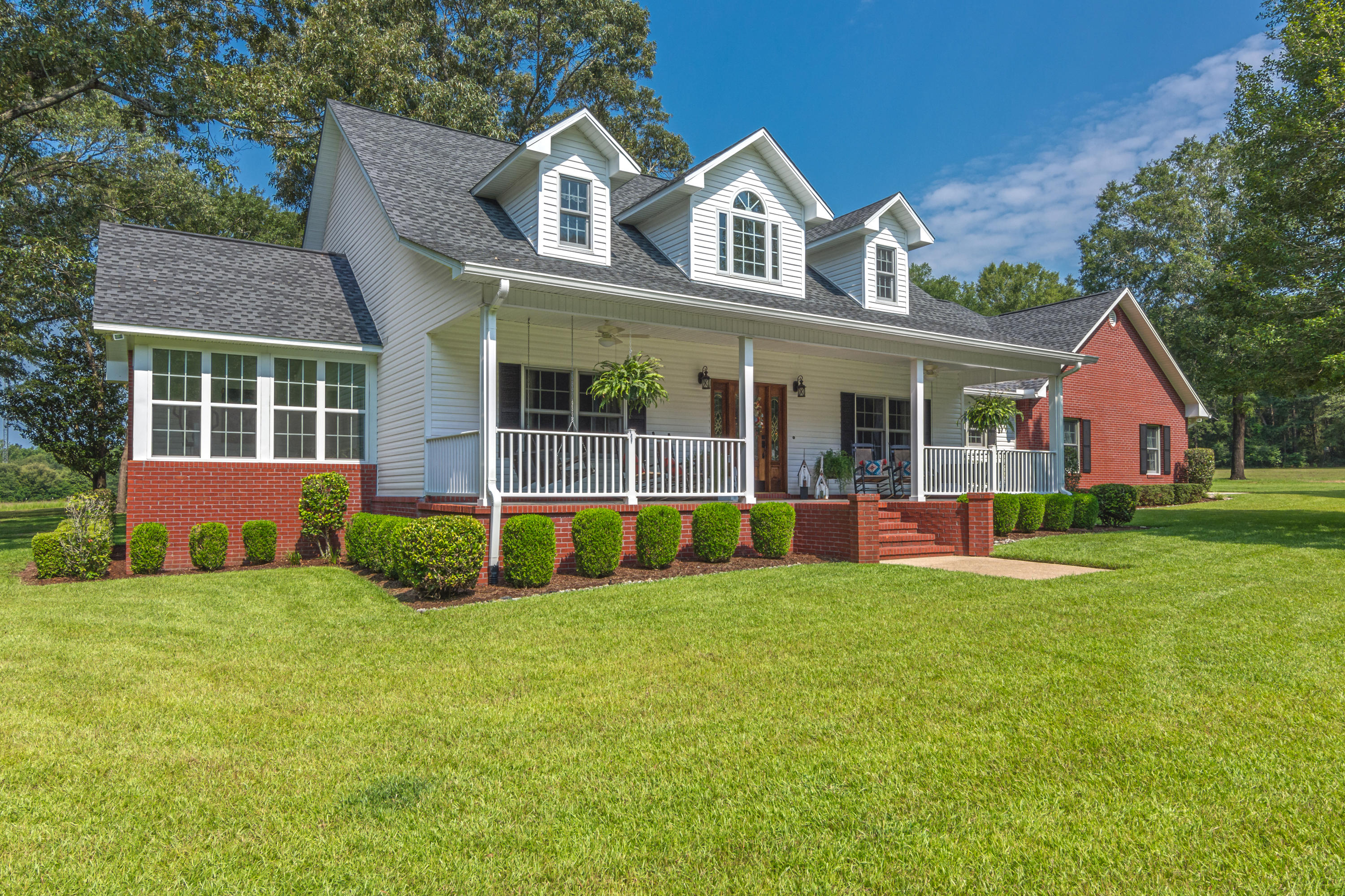 COUNTRY ESTATE!!! Stunning property w/ meticulously landscaped grounds and a front porch straight out of Southern Living! Enjoy your own piece of paradise and privacy on 11 sprawling acres in the country while still being within just minutes to town. Inviting entry showcasing a lovely staircase and nice open floor plan...you'll feel right at home! The living room features a gas fireplace and spacious kitchen has lots of solid cabinetry, breakfast bar and adjoining dining area. Great master suite that can accommodate all your large, oversized furnishings with French door that leads to a nice Florida room complete w/ tiled flooring. Master bathroom features lots of marble accents, dual vanity, dual closets, garden tub and separate shower. The additional bedrooms (which are a