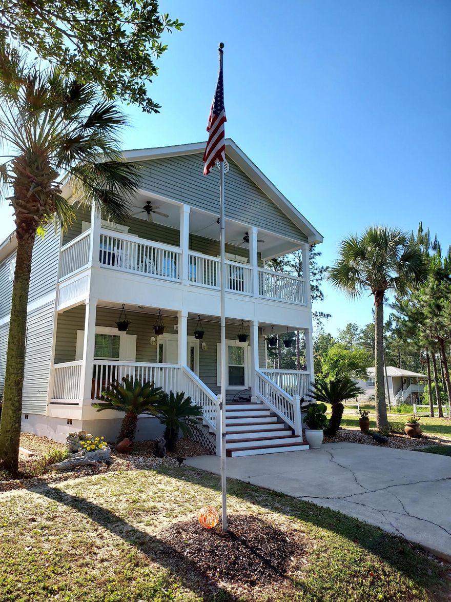 Amazing opportunity to own an incredible home in a prime location in N Santa Rosa Beach just ~3 miles from the Gulf of Mexico and beautiful beaches of South Walton, while being even closer to Choctawhatchee Bay! This home is on an expansive corner lot boasting over 1/3 an acre & has plenty of room for a pool or deck. The land is well manicured with beautiful trees and tropical landscaping. There are plentiful outdoor spaces to enjoy including a large front and back porch & two balconies. Pride of ownership is apparent as the home is very well maintained. Key updates are NEW ROOF June 2023, new hot water heater March 2023, 2 new AC's 2019 and exterior trim, porches & balconies newly painted. Seller also put in a new culver and second driveway for additional parking on the side of the home. There is a fantastic curb appeal with the landscaping and quintessential classic Florida front porch. A new culvert and driveway was just added on the side for easier access and additional parking and there is a new roof scheduled to be put on, which will be great for insurance. Upon entry, you will notice the beautiful true hardwood floors and great natural light with the large windows. The living area opens up nicely to the dining area making entertaining easy and beautiful crown molding extends throughout the home. There is a formal dining area for six but also a breakfast bar great for casual dining and even room for an additional dining nook off the kitchen. The kitchen features granite countertops, stainless steel appliances, nice cabinetry, a large window by the sink and a pantry. Across from the kitchen is a custom built-in office with granite countertops and ample cabinetry, half bath for convenience and laundry room with full size washer & dryer. Double doors lead to a spacious covered back porch right off the kitchen and is the perfect place to relax or even enjoy outdoor dining. There is a great little fire pit area in the backyard and also a shed to keep all your gear in. The side yard is truly expansive with a white fence and many possibilities. Great size for outdoor fun like volleyball, croquet, horseshoes & corn hole. Owner is also a talented artist and has unique artwork lining the stairway making it feel like you have a gallery in the home! These can be included in the sale if desired. You will be impressed with the very spacious master bedroom with fantastic natural light and crown molding. Master bedroom is generously sized and has a nice additional sitting area as well as a walk-in closet and ensuite bathroom. Ensuite master bathroom offers a granite double vanity, soaking tub to unwind in and separate walk-in shower. There is a large private master balcony with views of trees. Enjoy your coffee on the balcony upon waking. Also on the upper level are two guest bedrooms each with crown molding and direct access to an additional balcony. There is a shared bath with granite countertop and shower/tub combo. Rooms have been newly staged & decorated and is available for a small purchase. 

This property is in a prime location close to the bay to enjoy fishing, boating and paddling and only ~3 miles to the beach and Gulf of Mexico. Enjoy dining, shopping & entertainment options nearby at Gulf Place at the corner of Highway 393 and 30A along with the beautiful beaches and Gulf of Mexico at Ed Walline Public Beach Park. There is an amazing boat launch, Cessna Landing, only ~2 miles away which offers picnic tables, covered bbq and beautiful boat ramp. You can also easily get to more great dining on the Bay via Chat Holley including North Beach Social, Farm & Fire and The Bay Restaurant. Do not miss out on this opportunity to own an affordable Florida cottage close to 30A and everything you need.