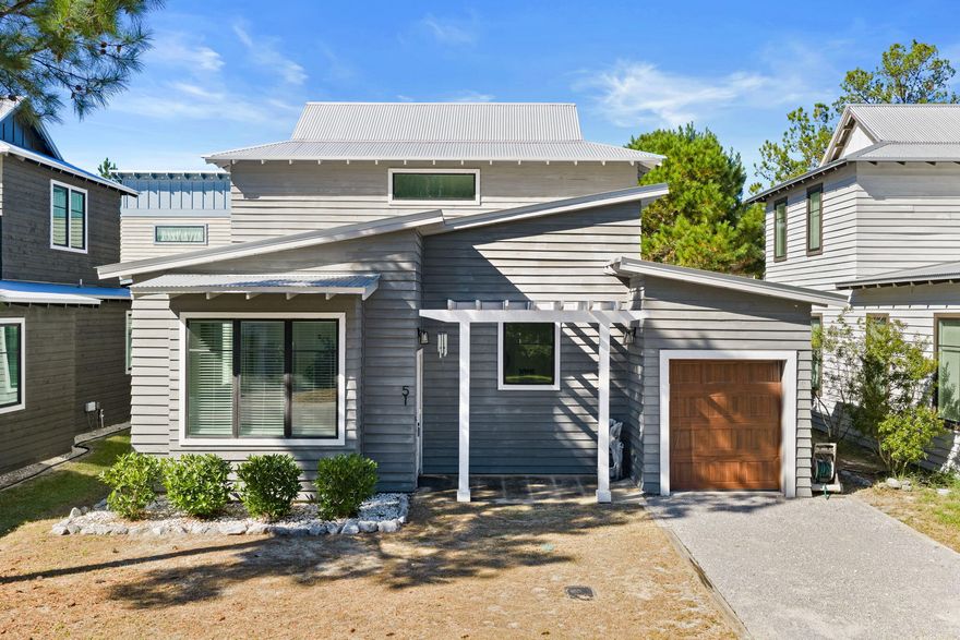 Boarded by the natural beauty of Eden Garden's State Park, this distinguished three-bedroom residence is the perfect culmination of historic charm with new construction design. Tucked within Point Washington, a mere moments to the Point Washington Landing/Boat Launch and the turquoise hued waters of the Emerald Coast, 51 Eden's Landing offers over 1,500 square feet among two levels, an attached single-car garage, primary suite on the main level, and hurricane impact windows. Approaching the property, the character of the cedar wood siding combined with the outdoor pergola make you feel right at home and welcome you into the residence.On the main level you'll notice Beautiful Tall ceilings heights and wood flooring highlighting the open concept space, and swiftly ushering you  from the bright living room into the fully-equipped kitchen.

Within the kitchen, you'll find a stainless steel appliance package, quartz countertops and ample storage space. Positioned with entertaining in mind, the breakfast bar also creates additional seating space for guests while overlooking the main living space.

The expansive primary suite is also found along the main level offering tall ceilings, walk-in closet, and private ensuite with featuring dual-vanity sinks, quartz countertops and glass-door walk in shower. Completing the first floor, notice the powder room just off the kitchen and laundry room for ideal functionality within the space.

Along the second level find two generously sized guest bedrooms each with access to the shared full bathroom offering tub/shower combination.

Ideally situated in Eden's Landing, you'll enjoy the advantages of living in a non-rental community with access to beautiful community pool, boat launch, and being conveniently located to Publix. The lifestyle grants you the opportunity to seamlessly arrive at the renowned Seaside, Watercolor, Seagrove to enjoy live music, local eateries, boutiques, and the local events the area has to offer.

Inquire to learn more or schedule a private showing today.