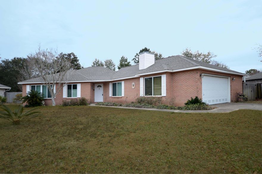 Tons of charm in this all brick home located in the quaint neighborhood of Robledal Estates, a picturesque bayfront subdivision with water access! Freshly painted and new wood plank tile throughout! This unique floorplan is sure to please, featuring two living areas each with its own fireplace! You will feel at ease knowing, this home has a new HVAC and new roof! The main living area contains a peaked ceiling and profusion of windows with two sliding glass doors that overlook the outdoor lanai that allow for ample natural light. All three bedrooms are generously sized with the master having a tray ceiling, two closets, a separate shower and whirlpool tub. Guest bath is generously sized and features a double vanity. Great open kitchen with beautiful white cabinets, plenty of counter space,