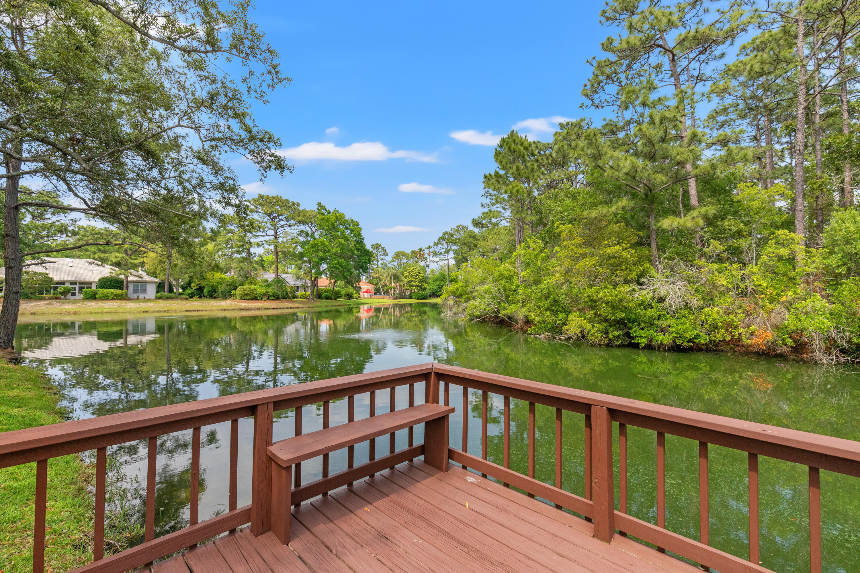 Serene lakefront on a nature preserve provides privacy for this three bedroom/three bath home with 75 feet on the lake, a two car garage and large porch with splash pool. Buyers will appreciate the heart pine hardwood and marble floors. Cathedral ceilings and bay windows let in abundant light. This community is a favorite among Sandestin owners for the friendliness and sociability of the neighbors. The location is hard to beat, with Sandestin golf, tennis, marina, Village at Baytowne Wharf, Grand Boulevard and more close by. Fish in the lake off the new dock in the backyard or stroll to the park with the large lake and wide walking path. Deerwood is the perfect setting to be as active as you like or relax on your porch or in the pool for some ''me'' time. See this one!