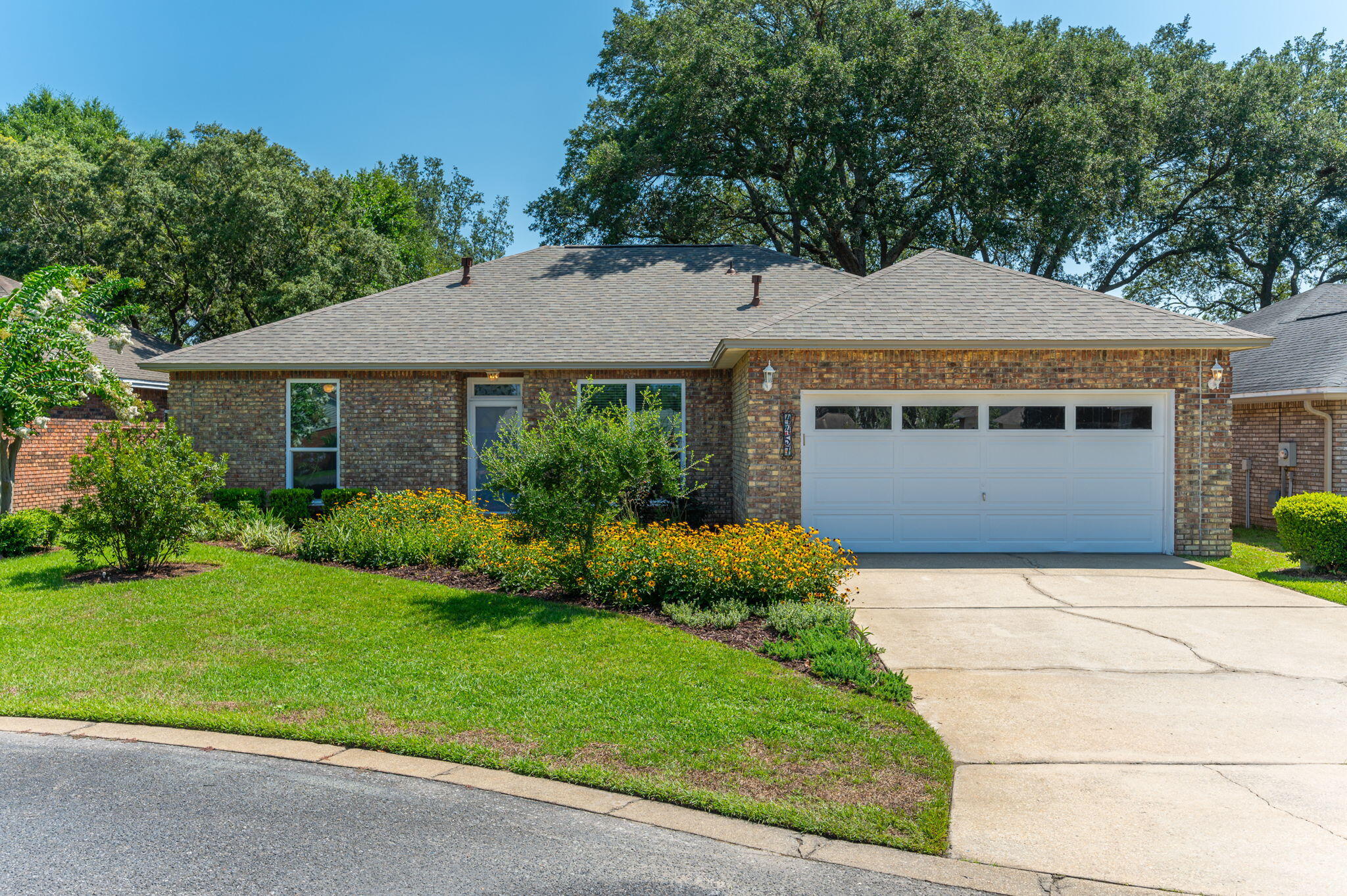 Welcome home to 4457 Parkwood Square - perfectly updated and ready to call home, this excellently maintained single story brick home features 3 bedrooms and 2 full baths, 2 dining spaces, an oversized family room with gas fireplace, and a beautifully updated kitchen. Located in the heart of Bluewater Bay, this fabulous property is walking distance to all BWB has to offer - easy to get to restaurants, the grocery and hardware store and easy access to the community recreational pool, tennis, pickleball and golf options. You'll love the long list of updated features on this home including NEW roof 2023, HVAC 2020, WH 2024 (to be replaced in July), newly updated kitchen cabinets, sink, faucet & disposal, quartz counter tops, Stainless steel dishwasher, Fridge, and gas oven. The natural gas fireplace has a custom mantel and the family room includes a vaulted ceiling with gorgeous wood beam and a newly replaced (2022) impact rated full view sliding glass door to the back yard. Additional windows have been replaced including the kitchen, dining room, and front bedroom - all impact rated and ready to go. 18" ceramic tile flooring flows throughout the living areas and kitchen while plush carpet adorns each of the bedrooms. Out back you'll love the fully fenced yard with irrigation (on a well) system, open patio, and room for a pool! This wonderful home is perfect for Florida living - come see it today!
