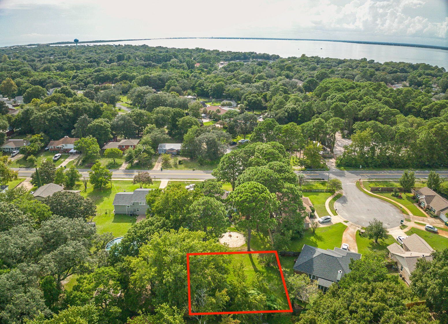 This lot is the back part of 618 Benning Drive, Destin, and can be obtained alone or as a part of the home purchase - keeping the large backyard! Or come build your Destin dream home. Land is in short supply in Destin, this lot will provide a tranquil setting for your forever home. Ideally situated in central Destin with an easy commute to schools and Joe's Bayou. Lot is partially cleared and there is a shed on the property. Sellers have a survey available.