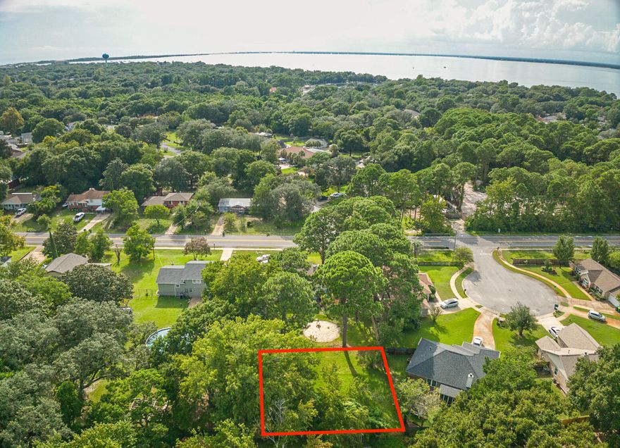 This lot is the back part of 618 Benning Drive, Destin, and can be obtained alone or as a part of the home purchase - keeping the large backyard!  Or come build your Destin dream home. Land is in short supply in Destin, this lot will provide a tranquil setting for your forever home. Ideally situated in central Destin with an easy commute to schools and Joe's Bayou. Lot is partially cleared and there is a shed on the property. Sellers have a survey available.