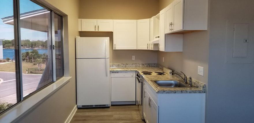 Great investment opportunity on Okaloosa Island with Sound view and beach access just down the street. This end unit has been updated with new cabinets, counters, vinyl plank flooring, lighting, plumbing fixtures, interior paint and more. New refrigerator and dishwasher 2020. Located in a 12 unit complex with covered parking and new dimensional shingle roof. There are other remodeled units available starting at $125,000, what a bargain. Zoned for vacation rentals to maximize your income or would make the perfect beach get away. This is the least expensive, updated unit on the island. Don't miss out on this deal.