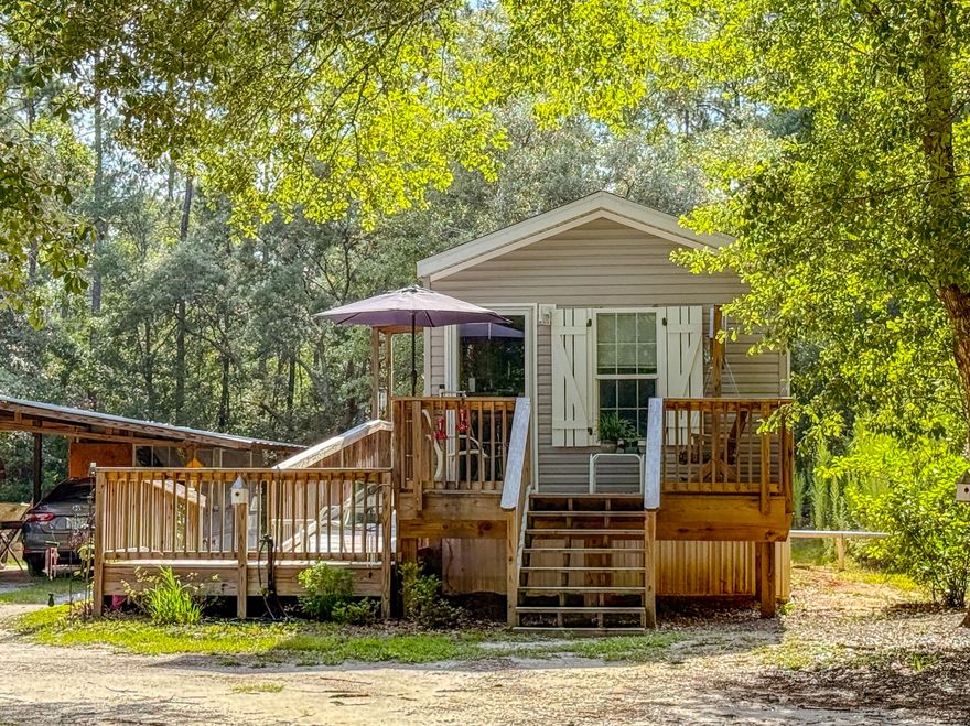 Charming Cottage on Over an Acre - Escape to peaceful living with this 1 bed, 1 bath cottage built in 2020. Set on over an acre with no HOA, flood zone X, this property offers a wheelchair-accessible ramp, city water, a full-size septic tank, and plenty of room to expand--including the ability to build your dream main home. Enjoy outdoor living, perfect for kids and a spacious yard for play or relaxing under the stars. Just 20 minutes from the white-sand beaches of 30A and minutes to Grady Brown Park and Black Creek boat ramps, this location offers the best of both worlds--quiet country living with easy access to the bay and beach.