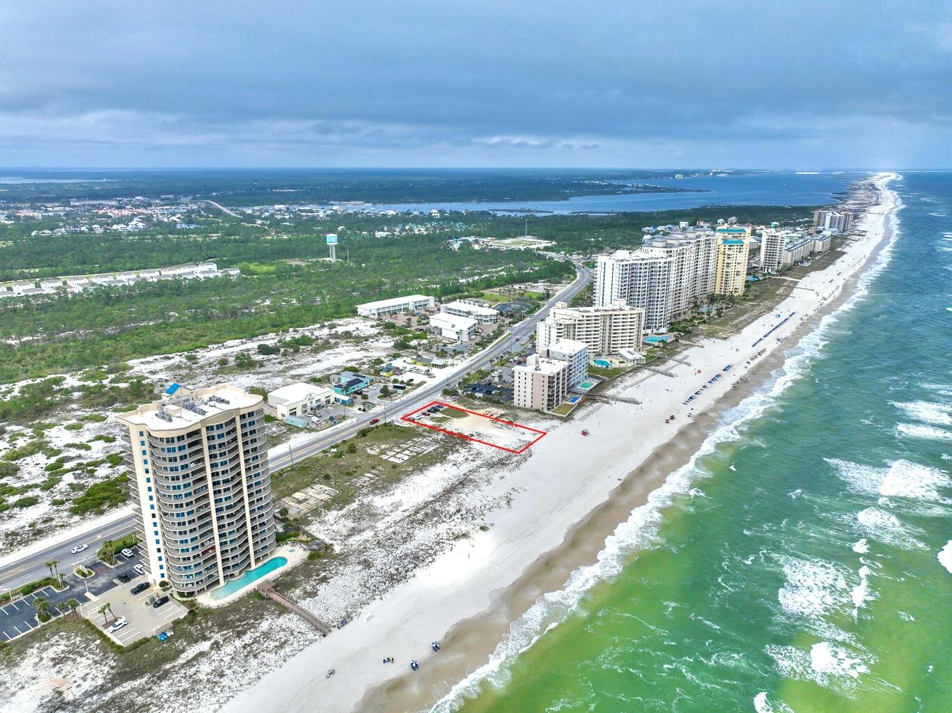Gulf Front Hotel/Condo Development Site - Prime Opportunity in Perdido Key. With the development order already approved, this property presents a turnkey opportunity for investors in the coveted Perdido Key area. This Gulf Front site spans an impressive 1.99 acres and boasts an approved development order for an elegant 14-story hotel/condo complex with a total of 50 units, offering 128 keys for hotel guests and condo owners alike. This development will feature a full-service restaurant, beachfront pool with cabanas, fitness center, state-of-the-art conference center with private meeting rooms, banquet room, and a three-story covered garage parking for up to 140 vehicles.
Perdido Key is renowned for its breathtaking Gulf views, sugar-white sandy beaches, and a serene coastal ambiance. This development site offers investors the chance to be part of a thriving community with endless recreational opportunities, from water sports to dining and entertainment. Don't miss out on this rare chance to shape the future of Gulf-front luxury living in one of Florida's most sought-after destinations.