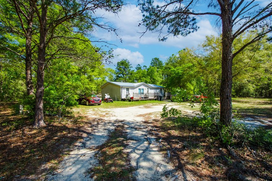 This  mobile home is nestled on the picturesque landscape of 4005 Rock Hill Road. Here lies a charming retreat. This enchanting property boasts an impressive 5 acres of lush sprawling land, providing an idyllic setting for peaceful living and boundless possibilities. Call today for your private showing,